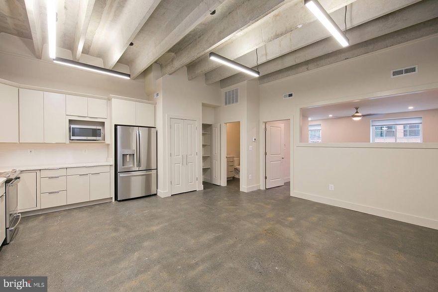 Industrial style loft on the downtown walking mall with masterful design and high-end finishes.  Sealed cement floors, high vaulted ceilings, wide open kitchen/living combination, and access to quaint workout facility and storage room make this loft your desired spot for year or years depending on your stay in Winchester! Parking space, electronic locks( Latch/Butterfly) all included in rent.  Only 12 month lease or more will be accepted.