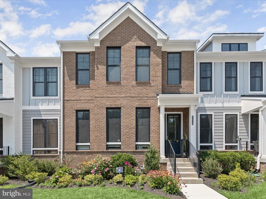 Step inside this beautiful townhome and be greeted by a spacious open floorplan featuring  9 ft ceilings, a neutral color palette and gleaming wood floors. The inviting living room boasts three large, bright windows and elegant crown molding. The adjacent dining area is perfect for hosting dinner parties or enjoying family meals. The gorgeous eat-in kitchen is a chef's delight, featuring a large granite island/breakfast bar with storage painted in a contrasting color. Beautiful ivory cabinets with pull-out drawers and soft-close technology are complemented by a stylish herringbone tile backsplash. Stainless steel appliances, including a gas cooktop, add to the kitchen's modern appeal. An inviting breakfast area provides a cozy spot for morning coffee. A conveniently located powder room completes the main level. On the upper level, you'll find the roomy primary bedroom, which features a tray ceiling, plush carpet, and a luxurious primary bath with double sinks, a large free-standing soaking tub, and a modern walk-in shower. Two additional bedrooms, a second full bath, and a laundry area complete the sleeping quarters. The lower level offers a spacious family room and a third full bath, providing plenty of space for relaxation and entertainment. The home also hosts a dual AC unit, one for the basement and one for the rest of the house. A two-car garage makes parking a breeze.