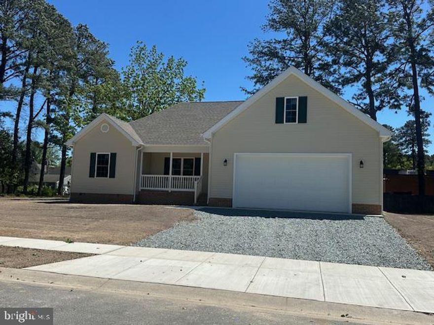 Open layout features kitchen with island. Dining area with sliding door to rear deck. Private primary bedroom with walkin closet and full bath. Home located in a completely maintained community. 2 car garage. Corner lot.