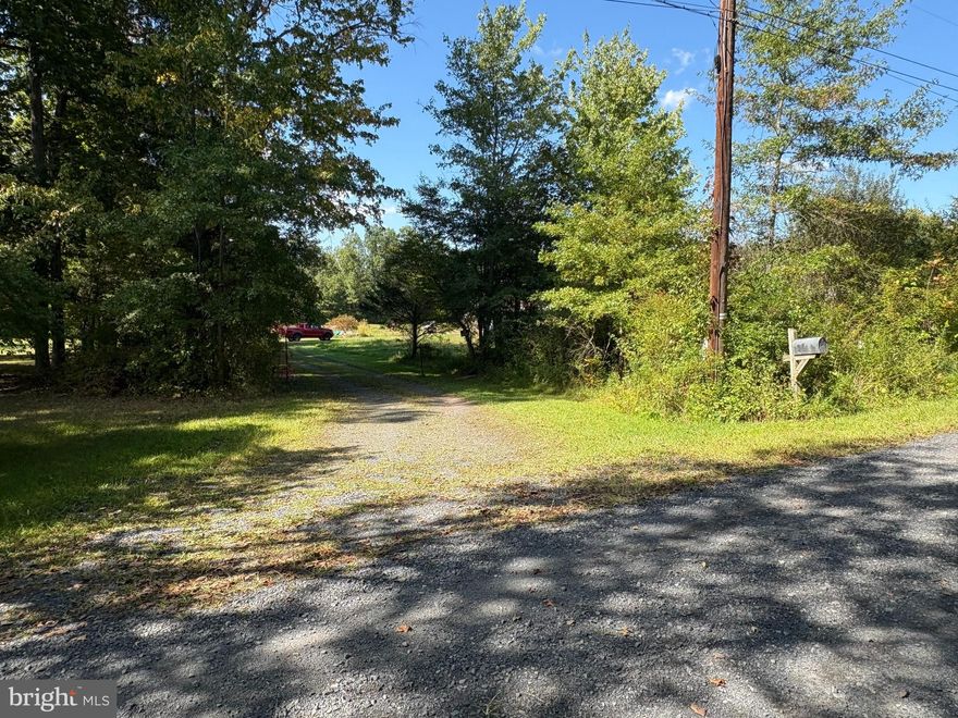 Welcome to a little piece of private heaven in Haycock Township.  This property was once a beautiful family homesite which was lost to a devastating fire leaving only two outbuildings on this 10 acre private retreat.  The almost 2000 square foot home was serviced by an on-site well and septic system which are still in place along with an electrical service line.   The  options are endless on these 10 acres from possibly rebuilding on the previous home site to finding a spot and making it your own.  You may be able to sub-divide the property if the powers that be allow it.  Just use your imagination.