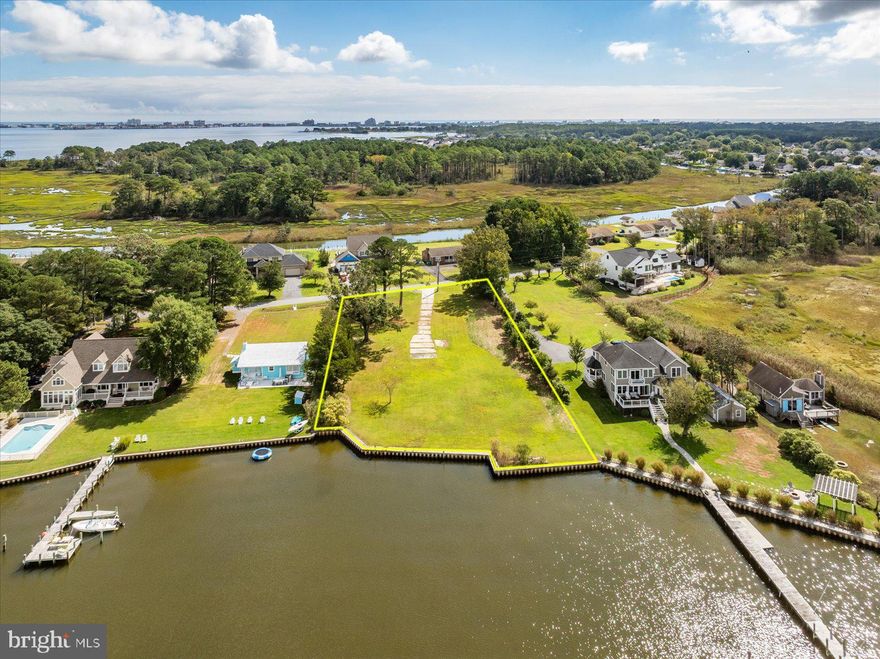 Waterfront parcel featuring gorgeous water views and sunsets.  Wonderful property to build you dream house on just a few miles from Ocean City, MD and all that it has to offer.  The everchanging views of this extra large lot that was once comprised of two parcels will not disappoint.  Survey attached to listing for reference.  Waterfront area measures 150' +/-.  Take a look at this property today and let your imagination run wild with the development possibilities.  Tax Assessor shows 1.14 acres on tax record, most recent survey completed in 2022 shows .99 acres.  Lot line highlights on pictures were completed by photographer and are for reference only.  Buyer shall complete their own survey and due diligence.