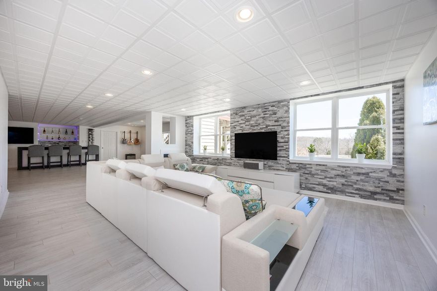 Spacious 5-Bedroom Luxury Home | Multi-Generational Ready | Entertainer’s Dream Lower Level ! Turnkey 5-bedroom, 4.5-bath home with over 5,000 sq ft of versatile living space designed for everyday comfort and effortless entertaining. Perfect for families, multi-generational households, or anyone seeking flexibility, this home blends modern style with functional luxury.  Step into the bright, open main level featuring multiple living and dining areas and a chef’s kitchen with high-end finishes — the perfect central gathering space for family and friends. The primary suite upstairs offers a private retreat with a spa-like en-suite bath, complete with a glass-enclosed shower and soaking tub. Additional bedrooms provide flexible space for family, guests, or a home office.  The fully finished walkout lower level is an entertainer’s dream, boasting a custom glass bar, elegant marble accent walls, ambient LED lighting, and a private gym with glass walls and doors. Whether hosting gatherings, enjoying a home theater, or creating a fitness retreat, this space offers endless possibilities.  Outside, enjoy a beautifully designed yard, patio, and outdoor living spaces ideal for relaxing or entertaining. With thoughtfully executed upgrades exceeding $200,000, this move-in ready home offers exceptional value in a convenient location near major routes, shopping, dining, and amenities.  Space. Flexibility. Luxury. Move-in Ready Comfort. 936 Marshall Drive is a must-see!