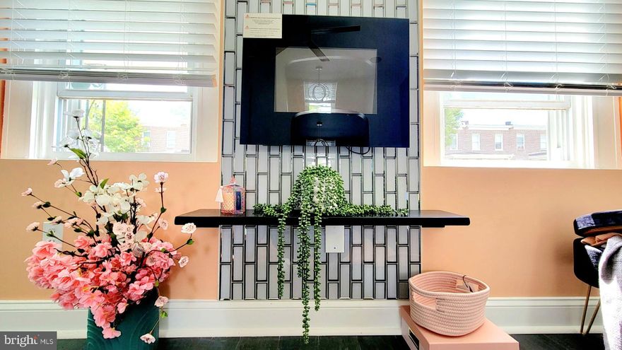 Welcome, all renters! This home is full of radiant modern upgrades, as soon as you walk through the front door from a covered porch. A new modern electric fireplace with special features sets the proper ambiance surrounded by glass tile. Lovely new flooring that brings you into the fully equipped kitchen with new elite black stainless steel appliances, quartz countertop, lovely white cabinets, and trendy black hardware. The kitchen is open into a dining area divided by a built-in breakfast nook finished with quarts. A USB combo outlets makes for charging devises a breeze. From the kitchen is a finished basement with a laundry room.  The fenced backyard is accessed from the kitchen that could be turned into a parking pad. This exquisite home has all new lighting features from recessed to pendants and ceiling fans. Details were not spared. This home is a must see, so come by and make this your home.