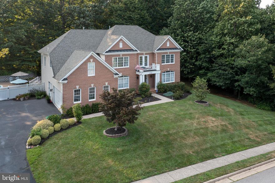 *** OFFER DEADLINE SET FOR 8/13 at 3:00pm. Read AGENT REMARKS for details *** Stately Brick Colonial with a Pool: Your Dream Home Awaits!** Nestled in a prime, private location on a quiet Fairfax Station cul-de-sac & backing to serene woods, this stately brick colonial is the epitome of elegance & comfort. Uniquely so, this home, along with 6 of their neighbors, is not located in an HOA.  The home boasts a sprawling layout with an impressive free-form pool & an expansive deck, perfect for entertaining. A composite deck, a large roll-out shade cover & a grassy section for play & pets complete the outdoor oasis. This grand colonial offers ample space with its coveted three-car garage, 5 bedrooms, & 4.5 bathrooms. As you step inside, you're immediately captivated by the unique dual staircases leading gracefully to the second floor. The first floor features a very large dining room & formal living room, both highlighting the nine-foot ceilings & huge windows throughout this home, that flood it with natural light. The kitchen is a chef’s delight, equipped with updated stainless steel appliances, two ovens, an island, an extra-large pantry & a bright, sunny nook leading into an open hexagon sunroom. From the sunroom, step out onto the composite deck & then onto the surrounding hardscape area of the pool & where you'll also find a relaxing hot tub. The backyard is also a gardener’s paradise with delicious raspberry & blackberry bushes. But it is the family room with its commanding 18 ft ceilings & tall palladium windows & gas fireplace which truly commands your attention as the heart of this home. Also on the first floor is a convenient 1st floor office, a 1/2 bath & a conveniently located laundry room. Upstairs, you'll find 4 bedrooms & 3 bathrooms. The master suite is an absolute retreat, featuring an enormous walk-in closet & a large luxurious bathroom with a soaking tub, large shower & two separate vanities. Two of the bedrooms share a Jack-n-Jill bathroom, while the fourth bedroom has its own private bathroom. The walkout lower level is an entertainer's dream with a huge recreation room, the 5th bedroom & the 4th full bathroom.  
 This 5th bedroom would be an ideal au pair or in-law suite!  Additionally, there is a very large storage area to meet all your storage needs. Don't miss this opportunity to own a piece of paradise in Fairfax Station where a myriad of trails connect you to nearby 888 acre Burke Lake, the South Run Recreation Center & many other nearby natural amenities!  Commuting is a breeze since it is so close to the Fairfax County Parkway with the nearby Franconia Springfield Metro, the Burke VRE, convenient commuter lots & buses to the Pentagon etc.  This special home is also proud to be part of the Lake Braddock HS & Secondary school & the award-winning Sangster Elementary School. Do not delay -- grand & well-maintained homes like this with soaring high ceilings & open floorplans don't come along very often in Fairfax Station!
