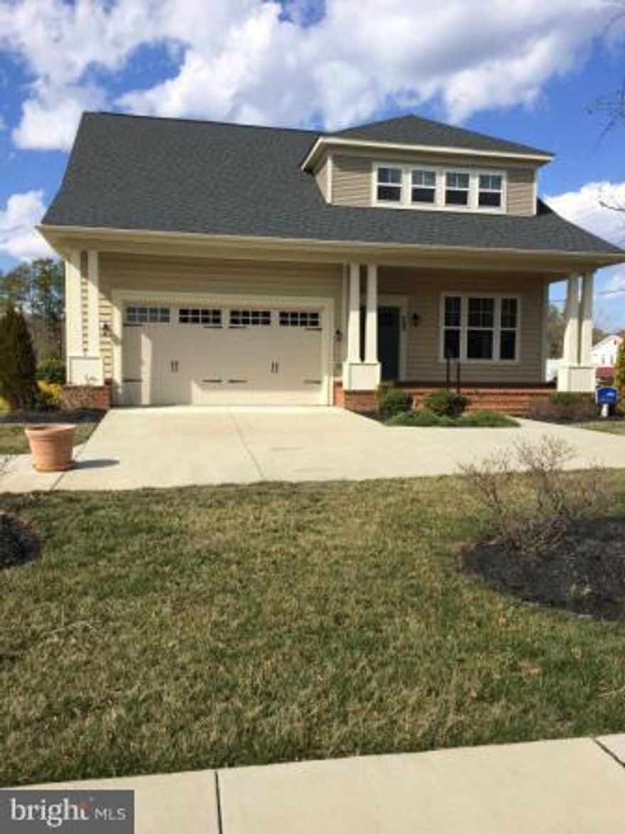 Rare opportunity to purchase this large, beautiful 4 bedroom FORMER MODEL HOME in over 55, water access/boating community in Solomon's Island MD.  So many options!!!  First floor master suite with tray ceiling and door to large back porch, 3 more bedrooms upstairs with a loft. Vaulted ceiling in family room,  gourmet kitchen, brick front porch and water table.PRICE REDUCED $50,000