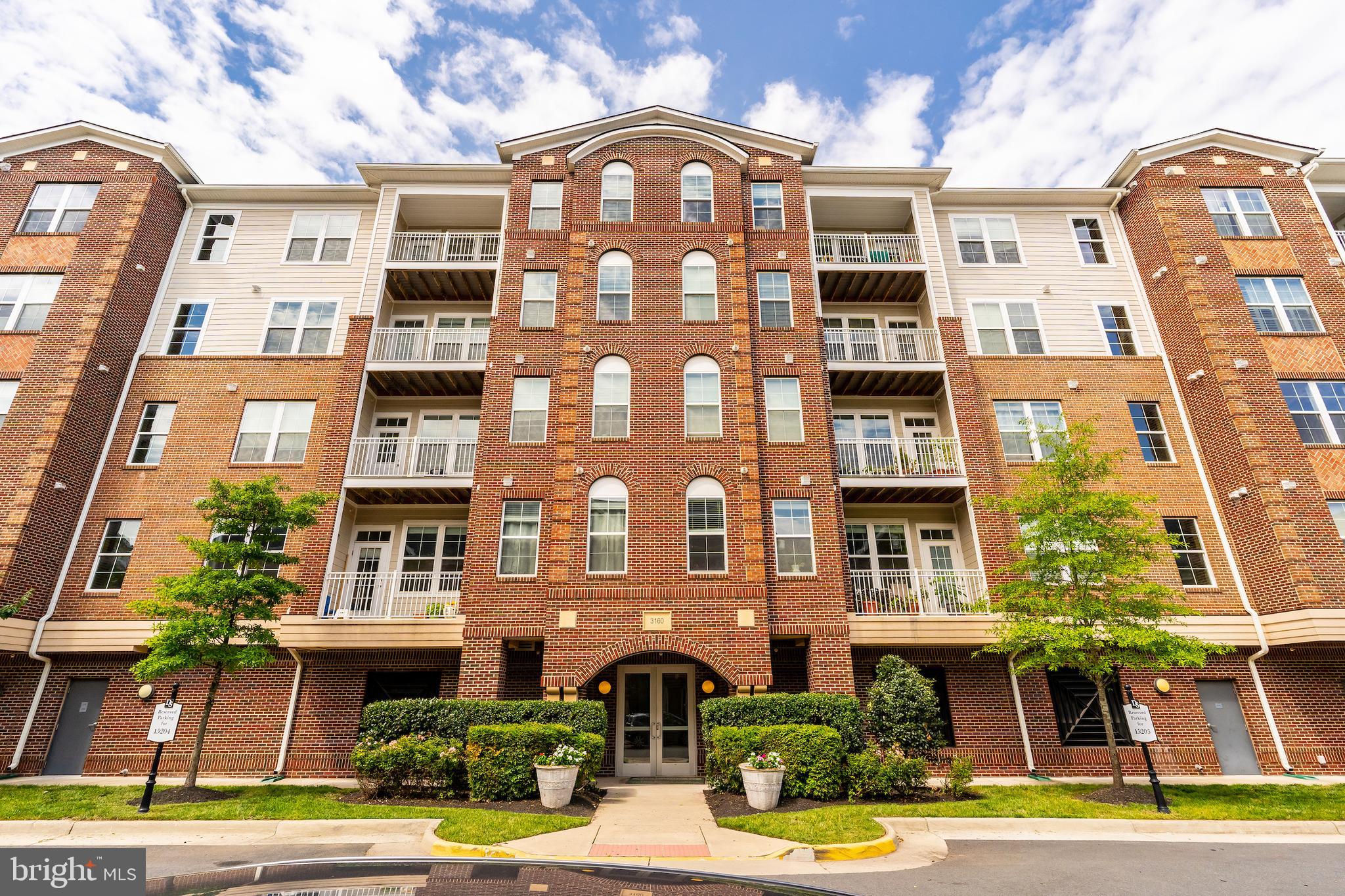 Beautiful Corner Condo in the sought-after upscale community of Discovery Square - urban living in the suburbs! Move in today to this 2 bedroom with 2 full en-suite bathroom "Aldrin Model" condo on the fifth floor penthouse. With 1,333 square feet, an open floor plan, and 9' ceilings, this sun-drenched condo lets the light shine in from all angles. Built in 2015, this condo has been newly painted, has hardwood floors in the foyer and living area, and comes with new carpet in the bedrooms. Enjoy cooking and entertaining in the gourmet kitchen with granite countertops, high end maple cabinetry, stainless steel appliances and a long kitchen island with barstool seating. Appliances include 5-burner gas range, 2 door refrigerator with ice-maker, built-in microwave, dishwasher, and pantry with plenty of storage. The kitchen island overlooks the dining area and living area with a decorative mantle and gas fireplace, and covered balcony to enjoy your morning cup of coffee. The primary bedroom has a walk-in closet plus a second spacious closet and en-suite luxury bathroom with dual vanity, vanity cabinet storage, and walk-in shower. The second bedroom includes 2 large closets and en-suite bathroom with tub that also connects to the foyer for guests. In-unit washer/dryer and coat closet in the foyer. There is 1 assigned parking space that comes with the unit - garage door opener included. Plenty of guest parking as well right outside the building. A commuter's dream, this location is only 10 minutes from Dulles International Airport with easy access to I-66 and the Dulles Toll Road and Dulles Greenway, Routes 28 and 50, and 3.5 miles to the Wiehle-Reston Metro Station for Silver Line access. Nearby, enjoy shopping and dining options in McLearen Square Shopping Center, Reston Town Center, downtown Herndon, Sully Highlands Park and new Sully Community Center (coming in Fall 2022), Steven F. Udvar-Hazy Center National Air and Space Museum, Horsepen Run Valley Stream Park, and so much more. Tenant responsible for: Gas, Electric, Cable/Internet. Water and Trash are covered by Landlord. NO PETS allowed. 12-24 month lease preferred. Security Deposit, First Month’s Rent and Last Month’s Rent required prior to beginning of lease. Rental Application via RentSpree (includes background check).