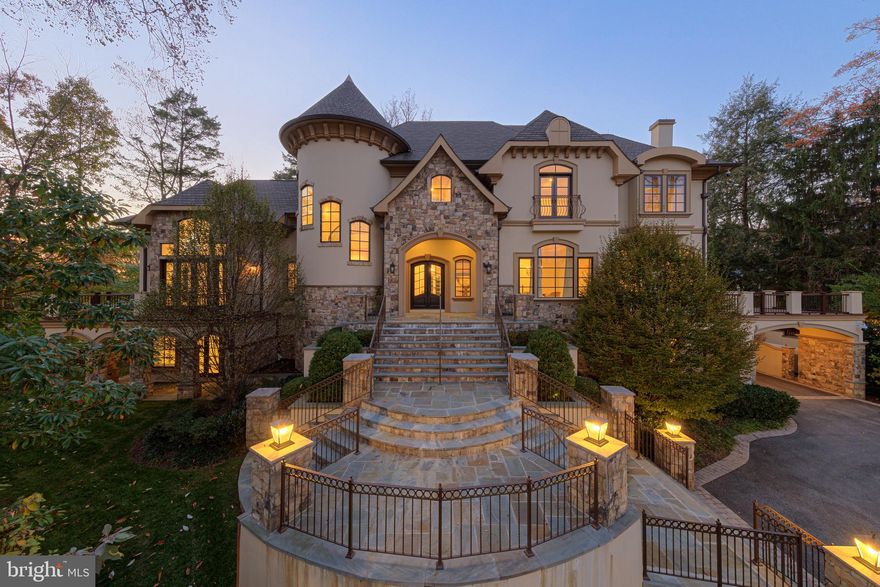 French Chateau masterpiece situated in the highly coveted Bradley Hills Grove of Bethesda. This estate boasts a thoughtful layout and a clean, contemporary interior (designed by the renowned Barbara Hawthorn), seamlessly blending glamour with functionality.

As you step inside, you'll be greeted by two-story ceilings followed by twelve-foot ceilings and unique ceiling architecture in almost every room, adorned with exotic Santos rosewood floors and inlay details. Elegant custom light fixtures and mounted accent lights gracefully highlight your fine art collection, while state-of-the-art lighting and automation add a touch of modern convenience to every corner of this exquisite home.

The main level features gracious proportions, generous windows and balconies off the library and living areas, offering expansive views of the meticulously landscaped outdoors. Windows throughout the house are adorned with shutters or motorized  designer window treatments, ensuring privacy and elegance.

For the culinary enthusiast, the main kitchen is equipped with a Sub-Zero refrigerator and double Wolf ovens with griddle and grill, while the adjacent catering kitchen boasts additional Sub-Zero refrigerator and commercial-grade equipment.

Entertain in style with a standout sunroom featuring an oversized party deck, and enjoy the technology package with speakers throughout the interior and advanced security for peace of mind.

The primary bedroom is a true oasis with a rotunda sitting room and a pass-through fireplace, leading to a balcony deck overlooking the lush grounds. This owner's retreat offers three closets, including a custom cabinetry showcase with glass-fronted doors, a stone island with drawers, and a full bathroom.

Additional highlights include an elevator, all secondary bedrooms with ensuite baths and extensive closets, and two separate staircases for added convenience.

The outdoor space is equally spectacular, featuring a pool, outdoor fireplace, manicured gardens, ample yard space for play, and a pool house complete with a full wet bar, an extra large bedroom, sitting area and a full bathroom.

The lowest level of the home boasts a gym, media room, a full bar area with a wine cellar, a SCIF room, and a walk-out covered wrap-around porch. With a four-car garage and porte cochere, this property exemplifies refined living.  Located near major highways, shopping areas and downtown Bethesda.