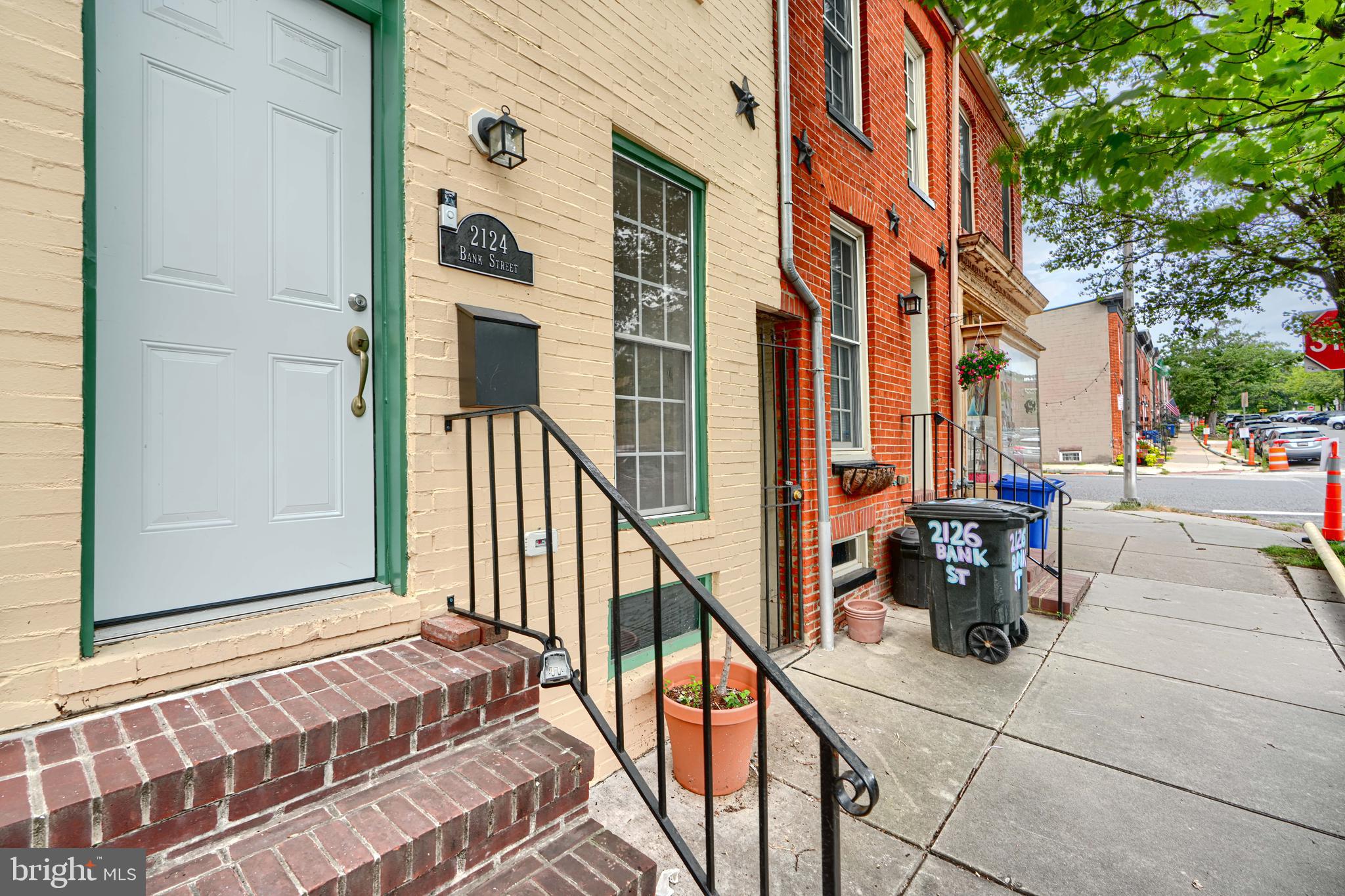 Discover 2124 Bank Street, a recently renovated rowhome nestled in Baltimore’s vibrant Riverside neighborhood (21231). This inviting rental features two bright bedrooms and two full & one-half baths, all illuminated by natural light through well-sized windows. Showcasing hardwood floors and an open-concept floor plan, the main living space flows seamlessly into a modern kitchen equipped with stainless steel appliances, granite countertops, and ample cabinet storage. For added convenience, enjoy in-unit laundry and central HVAC. Outside, an intimate private deck on 2nd level and rear 1st floor patio provides a peaceful retreat for morning coffee or evening meals. Just steps from scenic waterfront trails, park space, eclectic dining, and easy commuter access, this home perfectly balances city living with comfort and style.