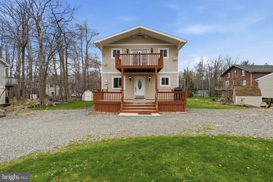 Welcome to your fully remodeled Pocono retreat in the sought-after Country Place gated community! This lovely 3-bedroom, 2 full bathroom, 2-story home has been thoughtfully updated inside and out, offering a perfect blend of modern finishes and inviting charm. Arrive to a spacious U-shaped driveway with ample parking and a welcoming front deck—ideal for enjoying the peaceful surroundings. Step inside to find gleaming hardwood flooring flowing throughout the home, complemented by a bright and airy living room filled with natural light. The beautifully remodeled kitchen features tile flooring, newer cabinetry, granite countertops, and stainless steel appliances—perfect for both everyday living and entertaining. Conveniently located just off the kitchen is the lower-level laundry room, followed by a fully remodeled first-floor bathroom. A well-sized first-floor bedroom adds flexibility for guests or one-floor living. Upstairs, you’ll find a second bedroom along with a gorgeous primary suite retreat. The spacious primary bedroom includes a walk-in closet, a fully remodeled en-suite bathroom, and elegant French doors that open to a private second-floor balcony—perfect for relaxing and taking in the fresh Pocono air. The home’s exterior has been upgraded with low-maintenance vinyl siding, and the expanded driveway ensures plenty of parking for residents and guests alike. Currently tenant-occupied, this property presents an excellent opportunity for both short-term and long-term rental income, or future personal use. Community amenities include a playground, basketball court, tennis court, outdoor ice skating, outdoor pool, and more! Showings begin Tuesday May 5th at 9:00 AM—schedule your appointment and experience this move-in-ready Pocono gem for yourself!