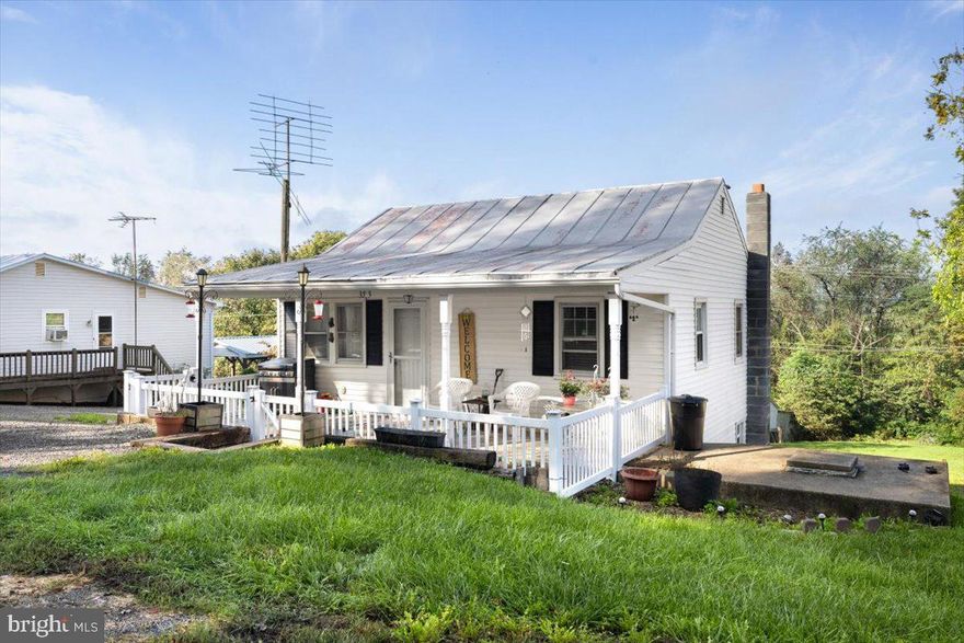 Charming Rancher in a Serene Country Setting! Nestled on a spacious 0.59-acre lot, this cozy 2-bedroom, 2-bath home offers over 930 sq. ft. of finished living space. The welcoming covered porch, fully fenced in, is perfect for enjoying quiet country evenings. Step inside to an open-concept layout combining the kitchen, dining, and living areas. The updated kitchen features a seamless flow into the pantry and refrigerator area, with a full bathroom conveniently located nearby. The main-level bedroom is just off the living room for easy access.  Head down the charming spiral staircase to the fully finished basement, where you'll find the second full bath, complete with stacked washer and dryer, and another bedroom down the hall. A basement door provides direct access to the backyard and a handy storage shed, perfect for all your outdoor needs.  Enjoy peaceful country living with all the comforts of home! Call today!