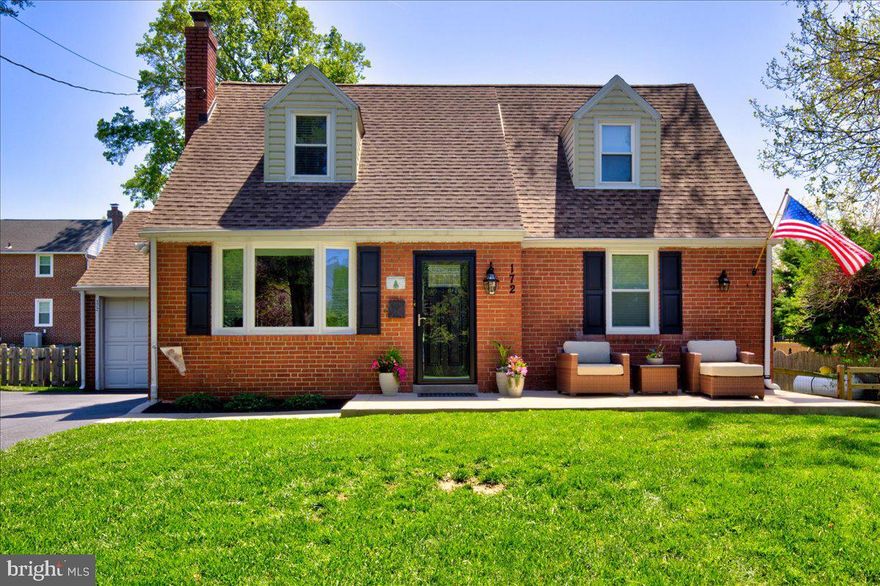 Welcome to this beautifully updated 3 bedroom, 2.5 bathroom, Cape Cod-style home, originally built in 1940 and completely renovated in 2019. This move-in-ready gem combines classic charm with modern conveniences, offering a welcoming and tranquil atmosphere throughout. The main level showcases an open-concept design, seamlessly connecting the living room and kitchen. The exquisite kitchen is highlighted by wood cabinetry, a built-in pantry, quartz countertops, a peninsula with seating, a subway tile backsplash, and premium Kitchenaid stainless steel appliances. Conveniently located off to the side is a private powder room and coat closet. A generous primary suite finishes off the main level. The suite features a comfortable primary bedroom, and through a rustic sliding barn door, you’ll enter a custom walk-in closet and a luxurious ensuite. The ensuite is equipped with a double-sink vanity, tile flooring throughout, built-in cabinetry, and a walk-in shower complete with a bench for added luxury. This home provides comfort and functionality for everyday living.  A custom hand made railing leads to the upper level of the home. Two additional cozy bedrooms with hardwood floors throughout are located upstairs along with a full bathroom. As this home was being renovated the roof was raised in the upstairs bathroom, an upgrade rarely seen in Cape Cod style homes.  The home also features a partially finished basement, providing versatile space for additional living and currently being used as an office. Laundry, mechanics, and storage make up the unfinished area of the basement. The entire property is meticulously maintained, with every detail carefully considered during the renovation process including the waterproofing of the exterior foundation. No expense was spared on the exterior of the home as well with new front patio and walkway, new spacious driveway which leads to the attached garage, new back patio which includes footers deep enough to build an addition if desired and a fenced-in backyard. The thoughtfully designed, neutral color palette and organic décor create a serene environment that complements any style. Situated in the sought-after Springfield Township, this home offers both peaceful living and easy access to local amenities, schools, and parks. Schedule your private showing today and don't miss the chance to make this incredible property your new home!