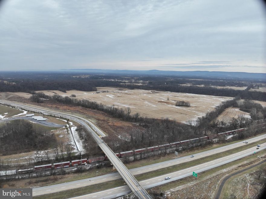 Discover an exceptional opportunity to own 194.48 acres of flat, partially cleared land in one of Jefferson County’s most strategic and rapidly growing corridors. Ideally positioned for industrial, commercial, or large-scale development, this expansive property offers unmatched accessibility, visibility, and long-term investment potential.
Located just moments from Route 9 with convenient connections to Rt. 480, Charles Town Road, and surrounding regional arteries, this site is perfectly situated for transportation, logistics, and workforce operations. The property also benefits from close proximity to key community and industrial anchors including the B&O Railroad, North Jefferson Elementary, and major employer Rockwool.
With public utilities available, infrastructure is already aligned to support development. The land’s flat topography and partially cleared landscape make it ideal for large footprints, staging, warehousing, industrial complexes, or future subdivision.
A partially paved, mostly gravel access road leads to the tract via Granny Smith Lane, ensuring smooth ingress and egress for equipment, trucks, and future operations.