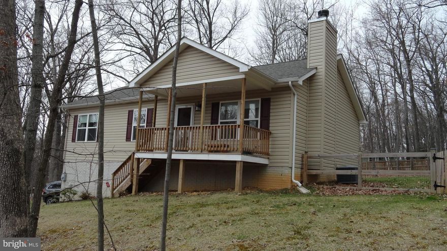 Sit on the DECK and enjoy the FENCED BACKYARD. Nice balance between woods & open space ensures your privacy. Covered FRONT PORCH. Full R/I in the partially finished Bsmnt.  Hardwood Floors. Stone Fireplace. Stainless Appliances. Mostly PAVED ACCESS.   COMCAST internet. Easy access to Rt9 &  Rt340-perfect commuter location.