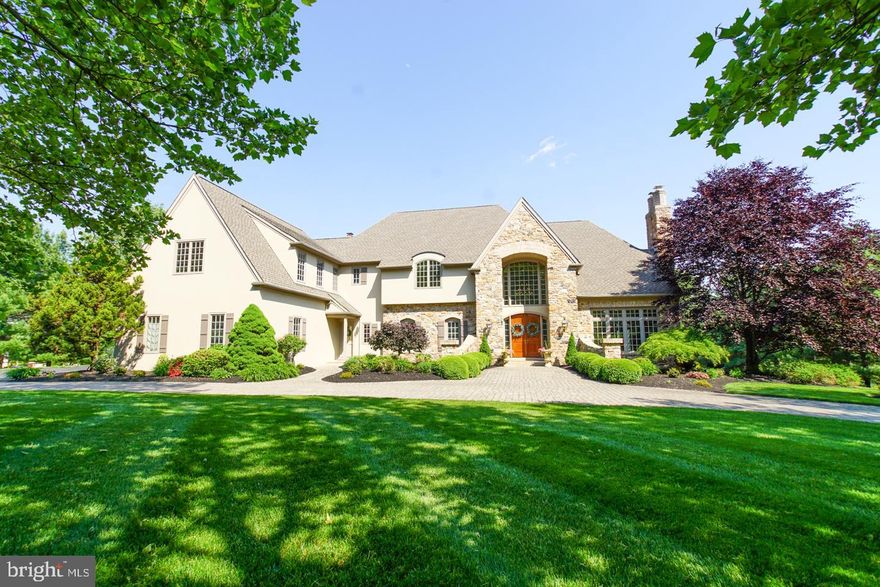 Welcome to this spectacular custom-built home by Richard Zaveta and located in the lovely area of Buckingham  Township, Bucks County.  This 7000 square foot home offers three levels of spacious living, (6) En-suite bedrooms, (3) Five-foot-wide staircases and true divided light windows through-out.  The exterior and Interior have been freshly painted and present with a clean neutral, ready to move-in home.  If you love curb appeal, we have it!  Lush landscaping and a paver circular driveway welcome you to the home entry.  The large stone arched front doorway entry is beautifully presented with 10’ wooden double doors and built-in display boxes and custom lighting.  Entering this home, you are welcomed with a 2-story entry, hardwood floors throughout the first level, 10’ ceilings and an open floor concept.  The two-story family room offers a  stone fireplace and views from every window.   The well-equipped kitchen with stainless subzero refrigerator, Wolf wall oven and microwave, an additional island oven, Miele Platinum dishwasher and 5 burner Thermador cook top is all you need for entertaining.  Custom white cabinetry, granite counter tops and island entertaining with seating and a walk-in pantry complete the kitchen. There is a breakfast room with access through the french doors to the  screened porch and beautiful views of the backyard pool.  The  screened porch and additional  deck area await your family and guests. The  ground  level walk-out offers a large bedroom and full bath with dressing area. Also included on this level is  a  private office, game room and a large basement area for storage. As you walk out the lower level french doors,  you are greeted with a lovely paver patio accessing the heated in-ground pool and views of all the lush landscape.  The second level bedrooms  are accessible from two staircases and feature vaulted ceilings and walk-in closets with built-ins.  The back staircase leads to Jack and Jill bedrooms with shared closet and bath.   This area is perfect for in-laws or Au pair. Two additional bedrooms with their own private bath are ideal for the growing family.  An  attractive master bedroom with two large walk-in closets with built-ins and a full master bath suite complete the second floor. Don't miss the abundant closet space on all floors. An oversized four car garage with storage closet, is suitable for the car collector as it has the capability to hold eight(8) cars. A 30 Kw whole house generator, (2)1000 gallon owned propane tanks, and a water conditioning system are added features to this home.