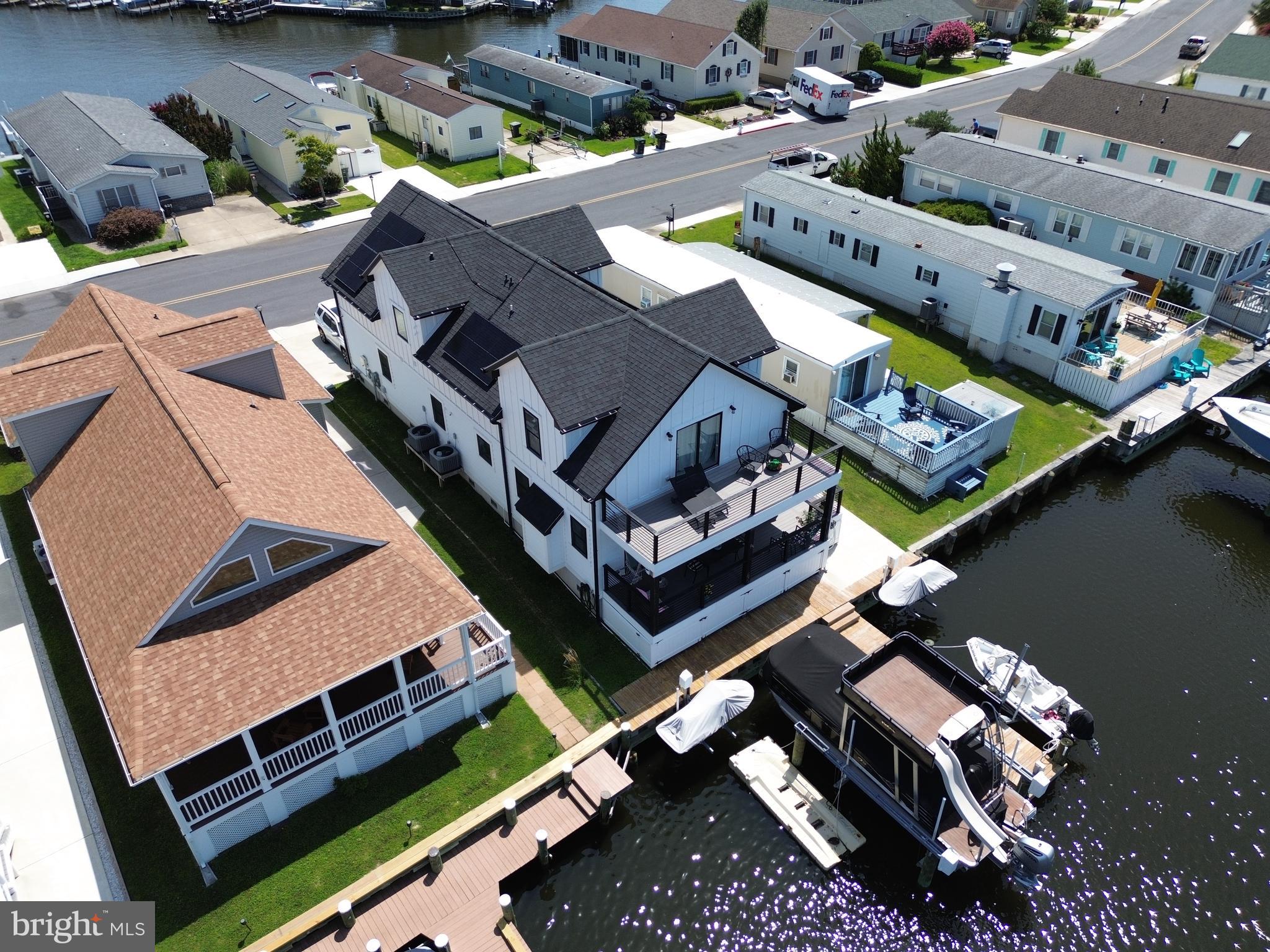 PLENTY of inside pictures coming by 8/18!!!! New Vinyl Bulkhead and New Jet Ski lifts and finger pier in 2021. Exceptional Custom-Built Waterfront Home in Montego Bay – 2,348 Sq Ft of Luxury on One of the Deepest Canals. Welcome to one of the most impressive custom homes in Ocean City’s desirable Montego Bay Community, where energy efficiency, thoughtful craftsmanship, and true waterfront living come together. Built in 2021, this exceptional 5-bedroom, 4.5-bath residence offers 2,348 square feet of beautifully designed living space with premium upgrades throughout — all perfectly situated on one of the deepest and widest canals in Montego Bay. Step inside and you’ll instantly feel the difference in quality and design. The heart of the home is the oversized gourmet kitchen, featuring solid surface countertops, generous cabinetry, and a large island with seating — perfect for gatherings, entertaining, or just enjoying a peaceful breakfast with views of the water. The main living and dining areas offer an inviting, open layout with plenty of natural light, water views from multiple angles, and access to the outdoor living spaces. Every inch of this home is tailored for comfort, functionality, and coastal charm. Upstairs, the private master suite is a true retreat — featuring its own private sundeck directly overlooking the water and a large walk-in closet, and a beautifully appointed en-suite bath. Imagine waking up to tranquil water views and stepping right outside to enjoy the breeze with your morning coffee. With five generously sized bedrooms and 4.5 elegant bathrooms, this home offers flexibility for large families, guests, or even a home office. Each bathroom is finished with modern fixtures and tasteful design touches that elevate the home’s appeal. Designed with energy efficiency and peace of mind in mind, the home is equipped with: A full solar panel system for energy savings, Two-zone energy-efficient HVAC for year-round comfort, A full-home fire sprinkler system for added safety. A high-end security and camera system already in place, Outside, your waterfront lifestyle awaits. The property includes a private dock with room for relaxing, launching, or entertaining — and best of all, the sale of this home includes the pontoon boat and (2) jet skis, so you're ready to hit the water the moment you move in.
Also featuring a covered first floor sundeck, well-maintained landscaping and plenty of parking and just steps to one of Montego Bay’s community swimming pools. Located around the corner from the 8-acre wildfowl lake, perfect for morning walks, jogs, or birdwatching. From the location to the layout, and from the amenities to the upgrades, this home was built to impress. Whether you're looking for a primary residence, vacation getaway, or income-producing property, this Montego Bay waterfront gem has it all.
This is a rare opportunity — schedule your private tour today and see what makes this custom home truly one-of-a-kind! HOA fee is $396.00 per year. Furnishings are Negotiable.