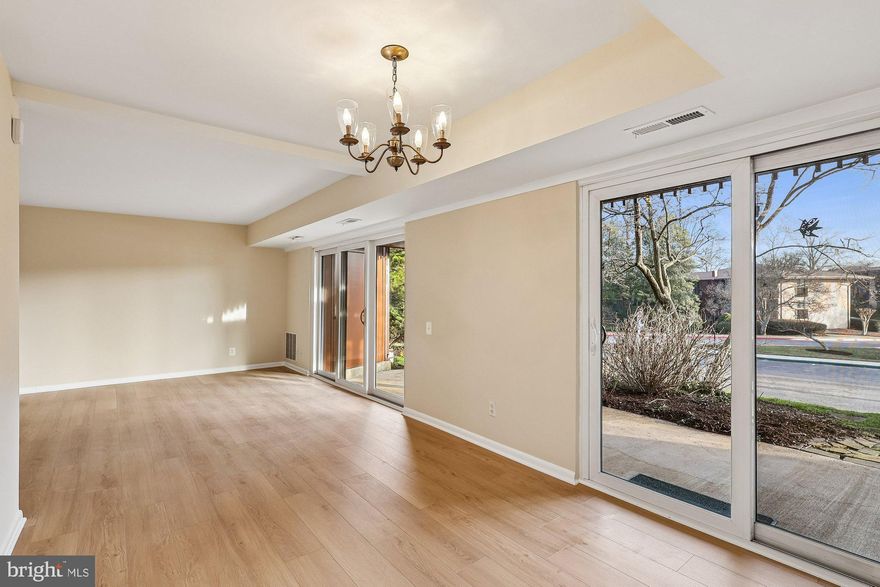 Your summer will be memorable when you settle into one of Eastport's most popular waterfront communities! Enjoy the convenience of a spacious "lock and leave" condo and the pleasure of Annapolis' fun waterfront lifestyle. This bright garden-level, 2-bedroom/2-bath condo in Severn House offers a short walk to the pool and the waterfront amenities. Freshly painted, this unit features new luxury vinyl flooring and new carpet throughout, creating a warm and inviting home with a comfortable floor plan. Each room has a large sliding door and an expansive view of the community. Plus, there are two private patios along the entire length of the condo offering outdoor space overlooking landscaped gardens. Great for parties or just relaxing at the end of the day! A 30+ foot boat slip is deeded with this unit (A-50); the slip is located near plentiful parking for easy unloading, and offers easy docking on a quiet part of the creek.  You will have a quick ride to a gas dock, to the Severn River or the Bay, and will be able to enjoy weekend getaways to St. Michael's or Baltimore's Inner Harbor. Severn House features a large community pool and portico overlooking the creek ... perfect for outdoor gatherings. The promenade along the waterfront will beckon you to take a morning or evening stroll...with views down Back Creek. Located in a peaceful setting, Severn House is within walking distance of Eastport's popular restaurants, shops, and clubs ... and downtown Annapolis and the Naval Academy. The water taxi to downtown Annapolis makes a stop at Severn House, so if you are feeling lazy, you can motor into town on a warm summer evening and enjoy the luxury of being dropped off at the door of your favorite spot.  Annapolis is just 5 miles from Rt. 50 and 97, so you'll have quick access to Baltimore, BWI Airport, Ft.Meade/NSA, and Washington, DC. Whether you want a weekend getaway or a relaxed full-time lifestyle, Severn House is a great option! New stove and new dishwasher, and refrigerator is only three years old. Amenities: EV charging stations; waterfront swimming pool with large patio, deck, views of the marina, WIFI; Small craft launch for kayaks, canoes, paddleboards; dock "bubbler" system; woodshop with professional tools; mature trees and native gardens, full-time, on-site manager; vibrant social life including garden club, book club, wood shop club, summer waterfront happy hours and summer water aerobics. Let's get moving!