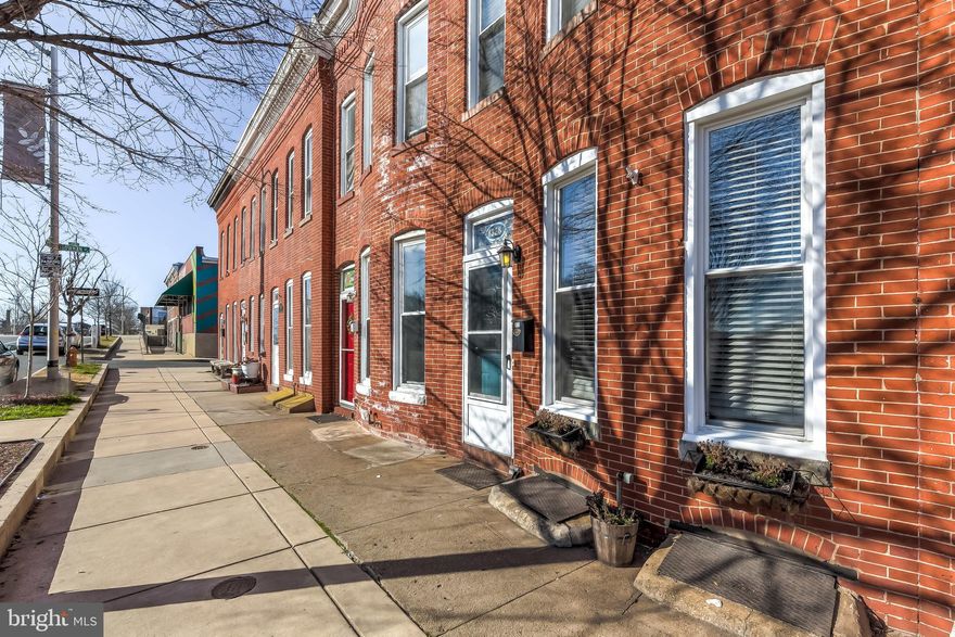 This charming 2 bed and 2 bath house sits right in the heart of Locust Point.  Walk out your front door and be steps away from Latrobe Park, Fort McHenry,  the Inner Harbor and McHenry Row!  Inside the home, you will find beautiful hardwood floors and exposed brick throughout.  New windows in 2018,  new water heater in 2017, main level full bath completely renovated in 2019, freshly painted this week.  Move right in ... nothing to do! A conveniently located laundry room in the back of the house, comes with extra storage and a full bathroom.  Open kitchen with granite counter tops. Vaulted, high ceilings in the master bedroom help it feel bigger than it already is!  There is a private back patio that is great for entertaining or could potentially be turned into a parking pad!  Although the current owners have no problem parking right out front of their house at anytime of day.  If you ever dreamed of living in Locust Point, in a house with all the character and charm of a Baltimore City Row Home,  walking distance to everything, then this is the home for you!