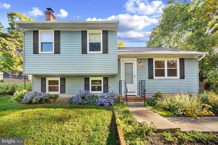 Classic split-level in sought-after Cape St. Claire offers lots of light and high ceilings for a spacious contemporary feel. Walk right into the main level with an open living and dining space with a glass slider that leads to a large new outdoor deck. The flow from the eat-in kitchen to the living area is perfect for ease of everyday living or entertaining! The lower level features a fireplace with charming arched brickwork and is perfect as a media room or additional living space. The lower level also includes laundry and outdoor access to the backyard. The upper level has a primary bedroom with en-suite bath plus two more bedrooms and a hall bath. This home is set on a landscaped lot that features established perennial beds and a private backyard. The front bay window overlooks woods and a serene setting. Cape St. Claire residents enjoy exclusive access to community beaches, boat ramps, fishing piers, a clubhouse, basketball courts, and tot lots—all for a nominal annual HOA fee. The community pool offers memberships, and local favorites like the Cape St. Claire Shopping Center, Graul’s Market, and Cape Liquors are just minutes away. Quick access to Route 50 and Downtown Annapolis, Sandy Point State Park,  and the Chesapeake Bay. Zoned to Broadneck High School and part of the Anne Arundel County Public School District.