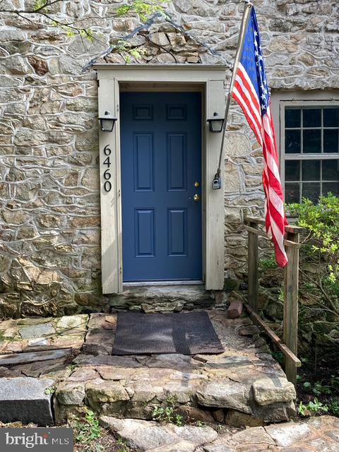 Historic Pre-Revolutionary Stone "3 Centuries Home". Discover the unique charm and possibilities of this charming, historic stone home with additions from two later centuries! Nestled on almost 5 acres with woods and stream, this one of a kind home originates from before the American Revolution 1770. One of the first homes constructed in this part of Lehigh County, the original stonework and much of the original interior has been preserved. The modest size home was doubled in size with a brick addition in the late 19th century, and then a spacious more modern addition with vaulted ceilings and rustic charm from historic post and beam timbers and wide plank hardwood floors were constructed in the 1970's, with some upgrades in the 21st century. Bring your own creativity to make this unique home your own.