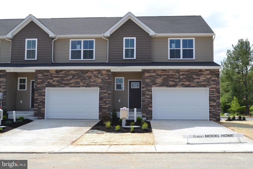 END UNIT - QUICK DELIVERY  LOT 24! The heart of the home features a stunning, upgraded kitchen, with white cabinets, quartz countertops, and a center island — perfectly connected to the dining and living spaces for easy entertaining or cozy nights in.  The open living spaces is a wide open, soaring great room with vaulted ceilings that instantly feels bright, airy, and welcoming.  Rear sliders lead to composite decks or concrete patios, depending on grade.  Upstairs, the spacious primary suite is your private retreat, complete with a primary bath with double bowl vanity and a walk-in closet big enough to impress. Two additional bedrooms, a full bath, and an oversized linen closet offer space for everyone.  These townhomes are designed with three professionally designed color palettes — so whether your style is bold, warm, or cool and modern, there’s an Addison that fits your vibe. Plus, this is truly low-maintenance living — the HOA takes care of lawn care and snow removal. Pair that with an oversized one-car garage and a location in charming Fleetwood, and you’ve got the ultimate in carefree, luxury townhome living.  One more thing...backed by the one year Builder Warranty, we've got you covered!
