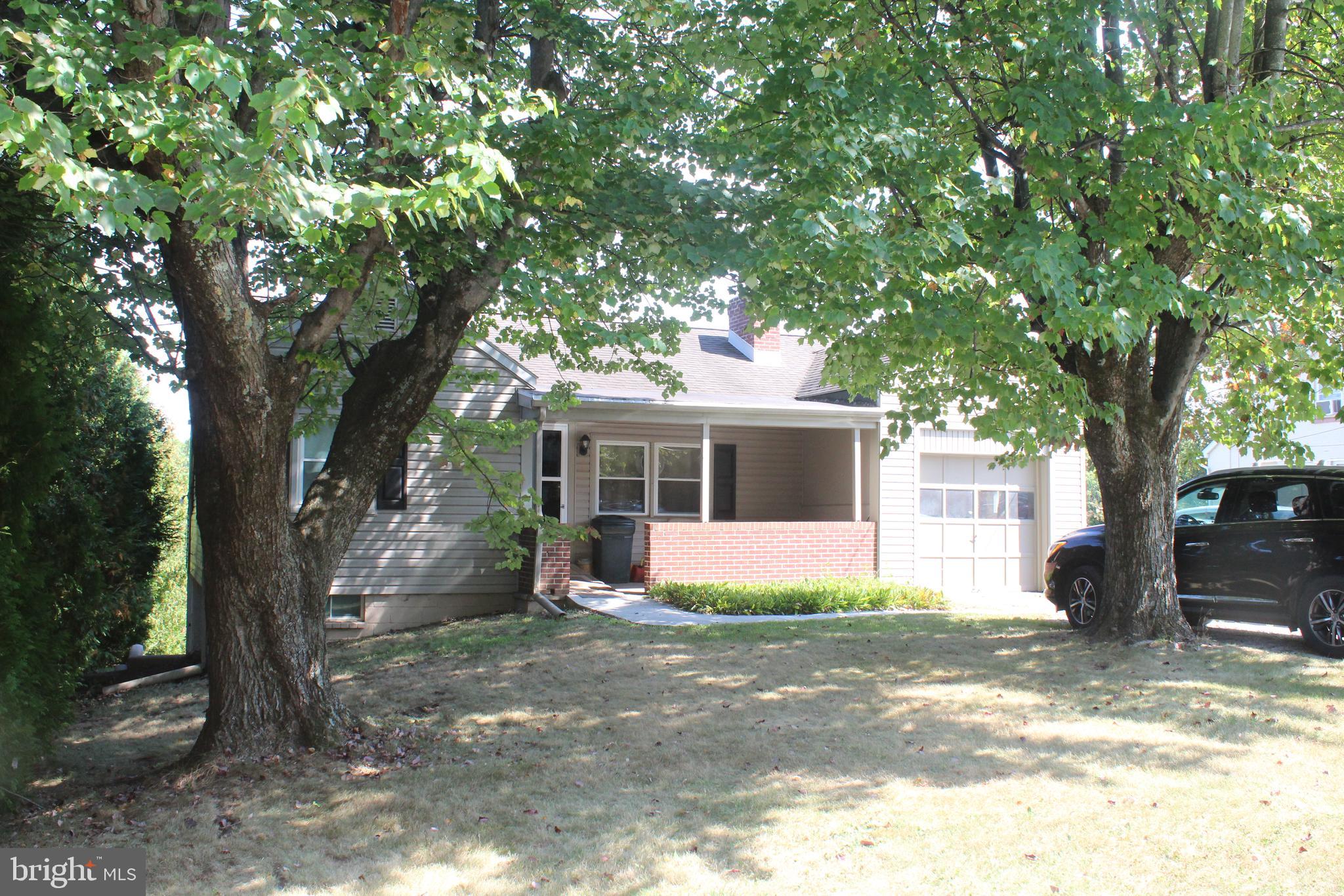 Very well maintained home! Covered porch with view of mature maple trees, natural wood floors throughout. Cozy wood burning fireplace in living room with double windows to let in natural light. Formal dining rm. just of kitchen. All new appliances (never used) with eat-in kitchen area. Deck just outside kitchen door to enjoy morning coffee. Separate laundry room 1st floor leading to garage. Full basement with plenty of space for extra rooms, includes wood burning stove and 1/2 bath. Basement exit to partially fenced yard . Detached barn/shed with 2nd floor. Furniture is negotiable.