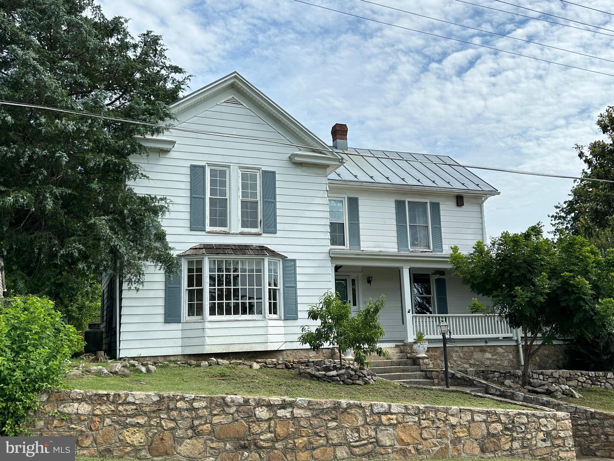 Charming CIRCA 1890 Colonial Home with Mountain Views & Beautiful In-Ground Pool. Walk to Historic Downtown. Step back in time with all the comforts of today in this beautiful Colonial home offering nearly 3000 sq.ft. of living space. Built in 1890, this one of a kind residence is full of timeless charm. Most rooms feature hardwood floors. There are 3 comfortable Bedrooms with built ins upstairs along with Full Bath and Laundry Room. You will Love the remodeled Kitchen complete with a Butler's pantry. This spacious home has many spaces to enjoy entertaining family and friends including Formal Dining Room, Living Room, Family Room, full Bath and Rec. Room.
Outside, enjoy your own private oasis on half acre lot with gorgeous in-ground pool, pool house and wrap around porch ideal for soaking in the mountain views.
Just a short walk to Historic Downtown Luray with access to restaurants, shops, breweries, coffee shops with friendly folks and local charm. Only minutes from Shenandoah National Park and the Shenandoah River and 2 hours from Washington DC, Maryland and NoVA. This property combines small town living with exceptional convenience.