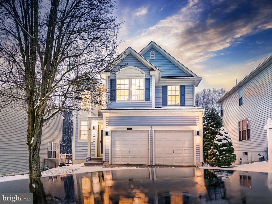 COMPLETE TOTAL  HOME RENOVATION IN 2024 ! This beautifully HOME blends modern elegance with cozy charm, offering the perfect backdrop for a comfortable lifestyle. With a total of 4 spacious bedrooms (3 on the upper level and 1 on the lower level), 4.5 bathrooms, there’s room for everyone to spread out and feel at ease. Inside you will be greeted by an open floor plan bathed in natural light, with large windows that make every space feel bright and airy. The heart of the home — a STUNNING new kitchen — features 42” wall cabinets, sleek stainless steel appliances, and granite countertops, making it a dream for both everyday meals and large gatherings around the holidays and other special occasions. The gas fireplace adds a warm touch, perfect for relaxing evenings. Durable luxury vinyl plank flooring runs seamlessly throughout, offering both style and practicality. A delightful sunroom extends your living space with a cozy spot for morning coffee, quiet moments with a book, or nature contemplation. Upstairs, you’ll find three generously sized bedrooms each with its own bathroom, a unique feature amongst homes this size. Two serene master suites with double closets, and spa-like bathrooms complete with modern vanities and a freestanding soaking tub offer a true retreat after a long day. The fully finished basement is a standout feature, offering a versatile entertainment area, an additional bedroom, and a full bath — ideal for hosting guests or creating the ultimate game night space. The home owner association allows rentals, long term as well as short term (no less than 30 days), opening the possibility of passive income by renting the entire basement. Outside, the spacious deck overlooks a peaceful wooded view, a private oasis for outdoor dining or simply enjoying the quiet of the neighborhood. Swap the back yard fun/hard work with amazing  community  amenities that include a pool. With a 2-car garage and a prime location in a sought-after community — just a short stroll to the pool, schools, and shopping — this home truly has it all. More than just a house, this is a place to create lasting memories. Come see for yourself — your forever home awaits!