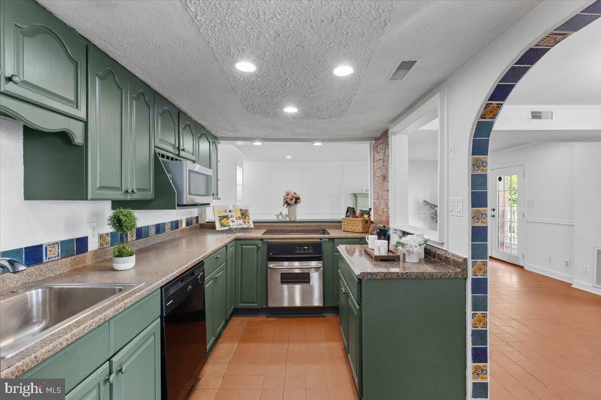 Step into this enchanting lower-floor condo featuring 3 bedrooms and 2 bathrooms, offering 1,500 sq ft of beautifully designed living space. Embrace the classic Spanish-style charm with graceful arches and a striking arch adorned with imported Spanish tile. Fresh paint, green kitchen cabinets, and tiled flooring bring a modern touch to the timeless design.
Cozy up by the electric fireplace on warm evenings, or open the double doors to reveal a private outdoor oasis—perfect for enjoying your morning coffee or unwinding at sunset. Bursting with character and thoughtful updates, this unique unit embodies comfort, charm, and the beauty of indoor-outdoor living, complete with a back porch and a water fountain.