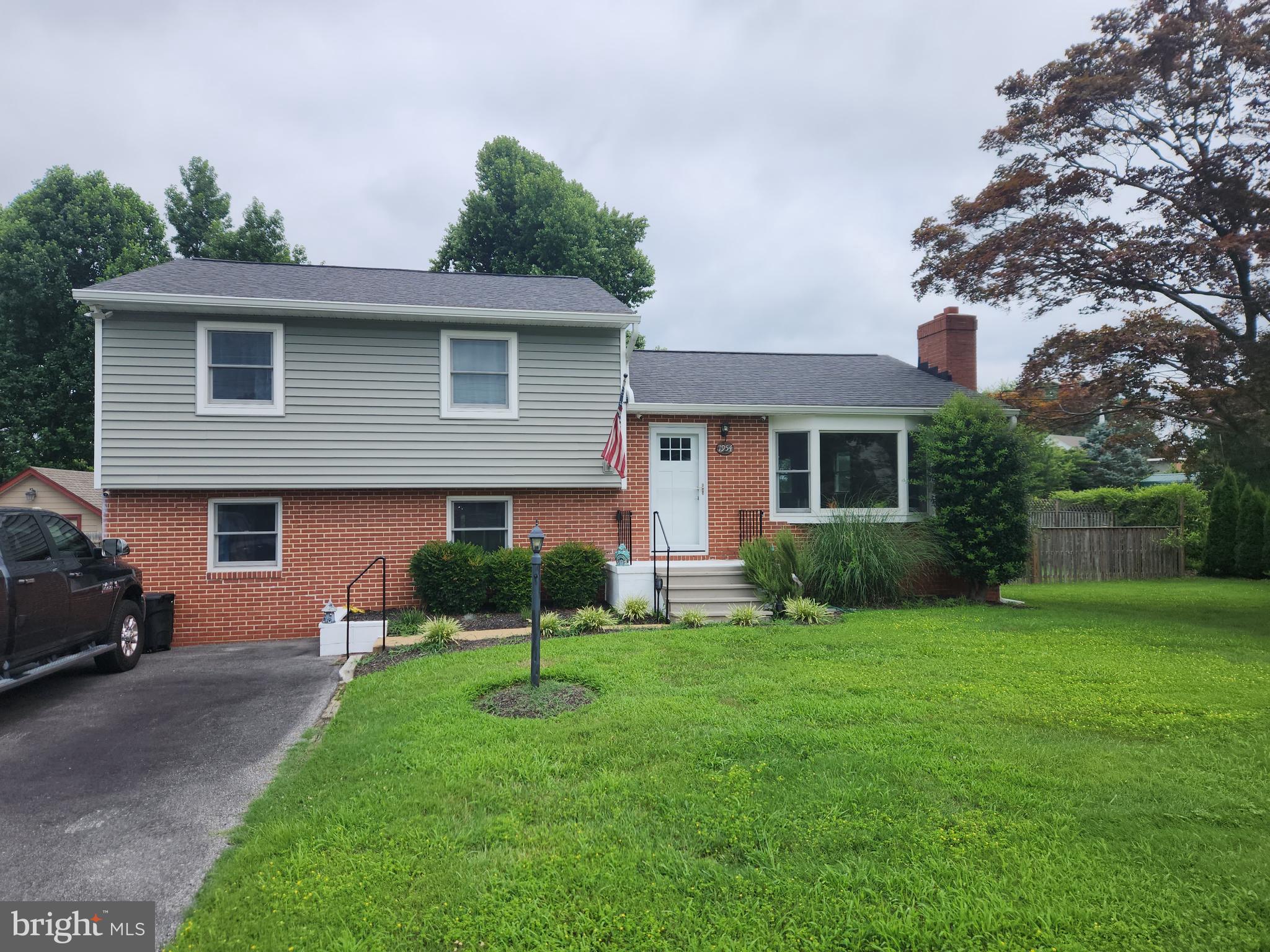 This charming 3-bedroom, 1.5-bathroom split-level home is tucked away on a quiet dead-end street, offering both privacy and convenience with easy access to major highways such as Route 50 and Route 97, as well as quick access to downtown. Recent updates over the past few years include a new roof, windows, and siding, along with a new HVAC system, updated bathroom and closets, new flooring on the ground level, fresh interior paint, and a newly paved driveway. Enjoy outdoor living with a generously sized screened-in porch that overlooks a patio and spacious fenced-in yard with no rear neighbors. The ground level also features a versatile bonus room with direct access, located just off the family room, offering plenty of space to fit your lifestyle needs. Additional highlights include a basement-level laundry area with a washer and dryer less than a year old, ample storage space, and a convenient half bath. This home has so much to offer and is ready to welcome its new owners. A must-see!
