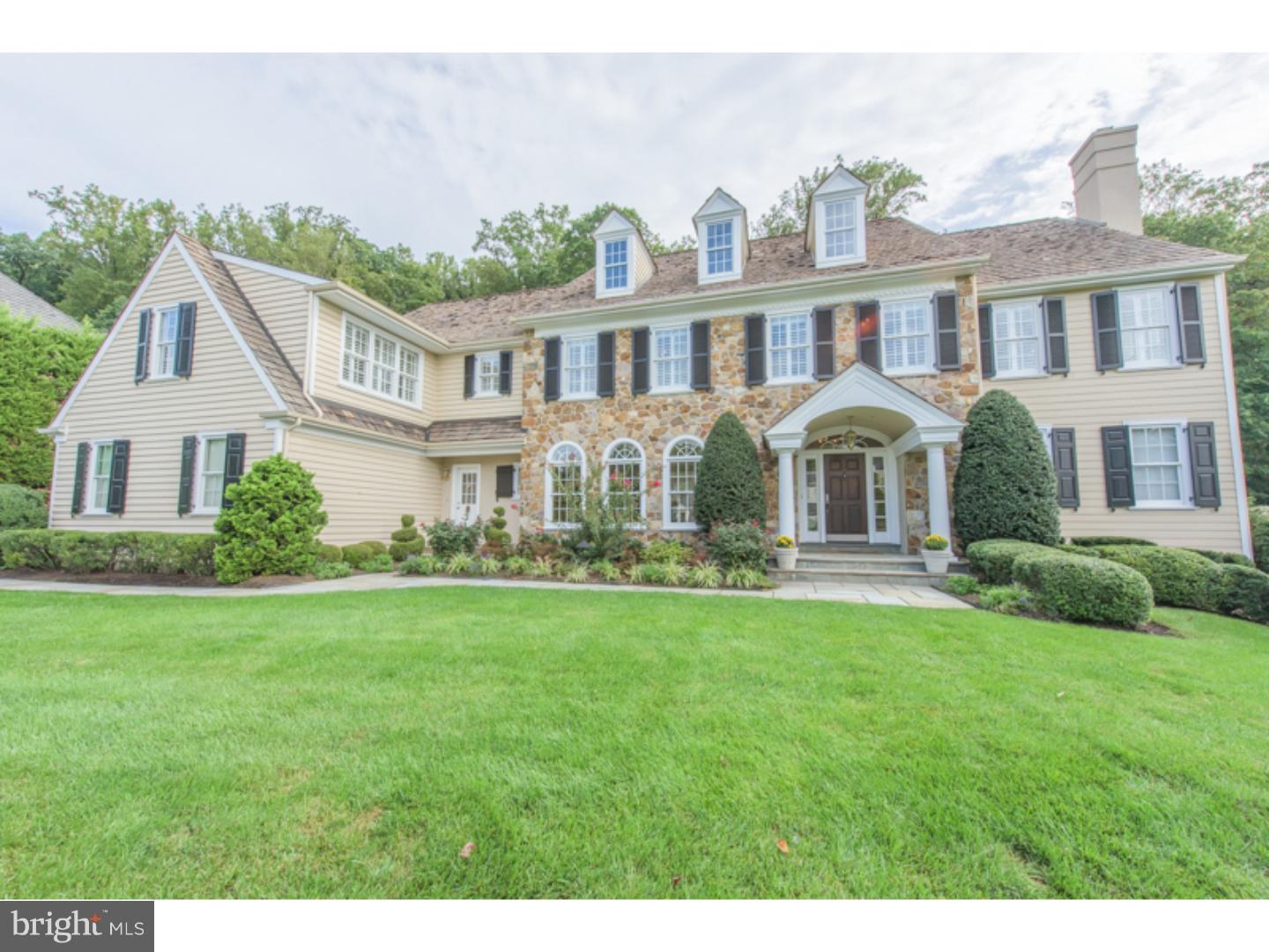 The combination of idyllic neighborhood setting and balanced classic colonial architecture is found in this fresh, updated 5-bedroom, 5.2-bath stone home in the community of Brooke Farm, Radnor township. Positioned on a slight rise on a .63 acre parcel and ringed by mature trees and professional landscaping, the home enjoys a salt water pool and spa with wide blue stone terracing and connected, shared landscape to a multi-acre neighbor. Of equal appeal is the beautifully selected interior, neutrally appointed with recently updated all-white chef's kitchen with thick granite counter tops, newly refinished richly-stained hardwood floors and 9-foot ceiling on the first level. Ascend a classic turned staircase to an indulgent master-suite highlighted by gas-burning fireplace, long views of the rear yard, generous closet space and en-suite bath with washstand-height his and her vanities, under window jetted tub and large seated shower. Four additional family bedrooms and three full baths are found on this level Finished lower level is complete with secondary kitchen, gym, full bath and recreation room with stepped ceiling detail and fireplace. Beautifully maintained, exceptionally located.
