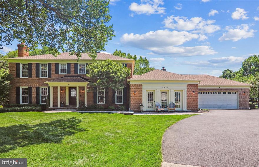Unique opportunity to own the expanded former model home of Potomac Chase on a premium nearly 1/3 acre corner lot. This stunning 4BR+den/3.5BA brick-front colonial spans 3220 SF above grade and over 4700 SF on all three levels.  Great curb appeal with a front portico entrance, hip roof, bonus great room addition, and a two-car garage while the inside has been transformed over the years and the quality of craftsmanship is ever-present.  Designer-home appeal including new custom painting, oak hardwood flooring on the main level, porcelain and travertine tile in the bathrooms, new stamped-pattern carpeting in the upper and lower levels, upgraded lighting, two fireplaces, elaborate moldings, and custom window treatments throughout.  Chef’s kitchen with custom cabinetry, stainless appliances, granite countertops, and center island opening to breakfast area and family room.  Former two-car garage converted to step-down great room, yoga studio, home office, or all of the above with 10-foot ceilings, hardwood flooring, recessed lighting, and French door access to front paver patio.  Private fenced-in backyard retreat featuring expansive paver patio, stone retaining walls, specimen trees and shrubs, stone bar with granite top and beverage fridge, waterfall and accent lighting features, outlets for outdoor string lighting or heaters, natural gas rough-in stub, retractable sun shade, stone firepit in yard, and relaxing hot tub.  Brick paver front walkway, flagstone front stoop with covered portico entrance; grand foyer entrance with solid oak staircase; formal living room with marble fireplace and adjoining dining room with bay window; main-level study with double glass-door entry, recessed lighting, and a wall of built-in bookshelves; gourmet chef’s kitchen with 42-inch painted and glazed maple custom cabinetry, granite countertops, glass tile backsplash, upgraded stainless appliances, built-in wine fridge, granite center island with new pendent light, recessed lighting, and a wall of pantry cabinets with slide-out drawers; breakfast area off of kitchen with new chandelier and bay window; family room with recessed lighting, brick masonry fireplace, and sliding glass doors to backyard oasis; double glass-door entry to step-down great room (that has evolved over the years from a playroom, to a home office, to a yoga studio, and many times all of the above) with hardwood flooring, recessed lighting, and French door access to front paver patio; renovated powder room with stacked stone wall and chic vanity with vessel sink; mudroom off of kitchen from the two-car garage with slate tile flooring, washer, dryer, and utility sink; primary bedroom suite with ceiling fan, two walk-in closets, and gorgeous renovated primary bathroom with vaulted ceiling, skylights, designer travertine tile flooring, new 9-foot vanity with granite countertop, undermount sinks, walk-in ceramic tile shower with frameless glass shower enclosure, two-person Jacuzzi soaking tub, and separate water closet; three additional bedrooms on the upper level each with double-door closets and ceiling fans; remodeled hall bath with double vanity, granite countertop, and designer tile flooring and tub wall surround; lower-level recreation room recessed lighting and multiple storage closets; den with closet and remodeled full bath with new LVT flooring, pedestal sink, and stall shower; architectural shingle roof (2018); h/e Carrier gas furnace and CAC (2015); 75-gallon hot water heater (2016); premium hot tub with new cover ($14K value).  Friendly North Potomac neighborhood with mature trees, sidewalks, and lots of green space area.  Only a few blocks away from Aberdeen Park which is a 14.5-acre Montgomery County park featuring a playground, tennis and basketball courts, a full-sized soccer field, a sand volleyball court, plus a picnic shelter area.