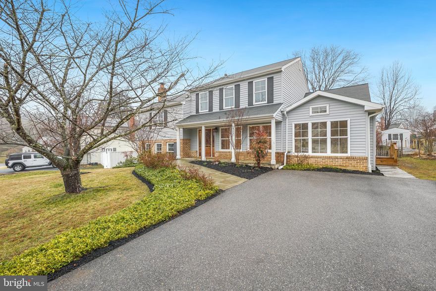 Welcome Home to This Magnificently Expanded & Updated Transitional Home in Sought-After Brookville Knolls!  Boasting over 4,000 square feet of beautiful living space, this exceptional home features newly refinished hardwood floors on three levels, high-end updates throughout, and an abundance of natural light from more than 50 replacement windows and multiple skylights. The gourmet kitchen is a chef’s dream, showcasing rich hardwood cabinetry, gorgeous stone countertops, stainless steel appliances, a large peninsula with seating, and a huge picture window overlooking the backyard. The open floor plan offers effortless flow—perfect for entertaining—with generous spaces for dining and gathering. The spacious main-level primary suite is a true retreat, featuring vaulted ceilings, a walk-in closet, and private access to the slate patio. The luxurious primary bath impresses with high-end finishes and custom tilework. Also on the main level, you’ll find a powder room, an oversized laundry room with side yard access, a huge pantry, and a charming den with built-in shelving and vaulted ceilings—ideal for game nights or a quiet cup of tea. Step outside to the expansive slate patio and discover a beautifully finished studio space complete with lots of windows, luxury vinyl flooring, ceiling fan, and plumbing rough-in—perfect for a home office or artist studio.  Upstairs offers a second en suite bedroom with a private full bath, three additional generously sized bedrooms sharing a hall bath, and a secret finished bonus room—great for play space or hobby spot. One level below the main living area, enjoy a welcoming family room with a wood-burning fireplace, plus a mudroom/potter’s room for added functionality. A huge unfinished basement provides incredible storage or workshop potential.  Additional highlights include a covered front porch and a fully fenced, flat backyard—ideal for cookouts, gardenting or peaceful outdoor relaxation. The home is also wheelchair-friendly on the main living level.  Located just minutes from the wonderful amenities of downtown Olney and assigned to highly rated schools, this fantastic home is an ABSOLUTE MUST SEE!