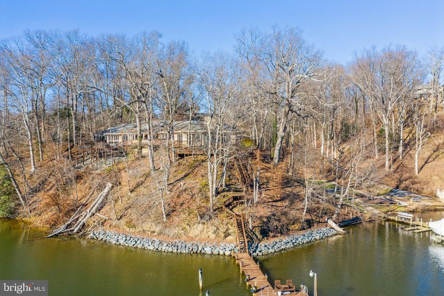 Waterfront private  contemporary perfectly sited on a waterfront peninsula. Highly desirable neighborhood of The Downs, gives you the sense that no one else is around and you are in your own serene nature  hideaway. Spectacular views greet you at the end of a private drive that opens to an abundance of nature, koi pond, water views and extensive outdoor decking. The architectural masterpiece, built by Johansson Greco  designed to flow in sync with its graceful natural setting making this remarkable home so uniquely Zen. Open living space, has been the perfect spot for family gatherings and entertaining.  The heart of the home chef's kitchen is centrally located with the right amount of work space and granite island. Living room with wood burning fireplace open to dining room is spacious  with high ceilings and skylights. Plants love this sunshine. The primary First floor master with romantic wood burning fireplace  with lovely views, private deck, and sauna in master bath.  High ceilings with Open flow and sunny  southern exposure.  Spend a peaceful afternoon enjoying your Swim Spa on the deck and dine alfresco. Take advantage of easy water front access from your private Deep water  pier for boating, kayaking or paddleboarding. Protected Clement Creek harbour. This home is perfect for remote working or learning with its wealth of comfortable spaces both indoors and out. Leave your troubles behind and come find your little slice of heaven at 1590 Lancaster Green.