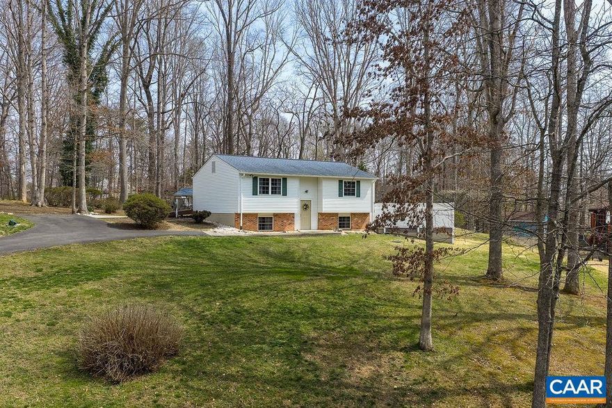 This incredibly well-maintained home in leafy Barboursville offers no step access and sits on a near half-acre lot. The main level includes a spacious living room, dining area, kitchen with breakfast bar, two bedrooms and a full bathroom. The  basement level features another large bedroom, rough-in for future half bathroom, family room with gas fireplace, laundry, and walk out. Just off the dining area is an expansive back deck, perfect for grilling, entertaining and has a ramp which provides no step access to the main level. The yard is perfect for gardening, play, and pets. Privacy fencing, generator, and shed for additional storage. Just minutes from restaurants, shopping, and NGIC. 15 minutes to the airport. 30 minutes to the Downtown Mall and UVA.,Fireplace in Family Room