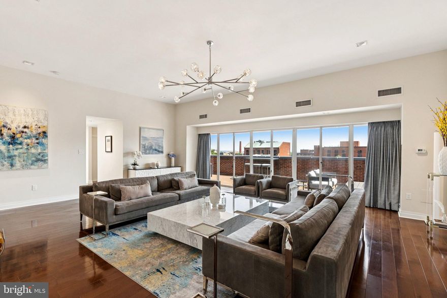 MAGNIFICENT TWO-STORY PENTHOUSE SUITE AT THE BOUTIQUE MADELON CONDOMINIUM IN THE HEART OF GEORGETOWN! Spanning nearly 3,500 sqft, this 5 Bedroom, 4.5 Bathroom residence offers elegant living on a grand scale, highlighted by a 600+ sqft private terrace with sweeping cityscape and monument views. Thoughtfully designed with sophisticated finishes and top-tier luxury appliances throughout – this home is an entertainer’s dream! The expansive Living Room is outfitted with an abundance of natural light per the floor to ceiling glass doors that overlook the private terrace and provide impeccable city views. The Living Room also features a wood burning fireplace and flows seamlessly to a stunning 26-foot Dining Room – perfect for hosting unforgettable gatherings. The custom chef’s Kitchen is appointed with top-of-the-line WOLF appliances, an oversized paneled SubZero refrigerator, quartz countertops, an island, and bespoke kitchen cabinetry. A stylish Morning Room offers casual dining, a built-in SubZero wine refrigerator, pantry and additional storage. This upstairs entertaining level is finished with a spacious Library, Powder Room, Laundry, and Bedroom with en-suite Bath. Skylit central stairs lead to a private bedroom level, where the luxurious Primary Suite boasts a generous walk-in closet and spa-like Bathroom with marble mosaic tile floors, dual vanity sinks, custom frameless glass shower with integrated oversized soaking tub as well as a separate shower. A second owner’s Bedroom Suite enjoys an en-suite bath and walk-in closet. Two additional Bedrooms with a shared hall Bathroom complete the level. Residents enjoy access to a private rooftop pool and terrace, concierge service, rentable underground garage parking, and direct access to some of Georgetown’s most iconic destinations—Café Milano, Peacock Café, Brasserie Liberté, and the shops and fitness studios along M Street and Wisconsin Avenue. This penthouse is your ultimate Georgetown retreat for refined city living and exceptional entertaining in an unbeatable location!