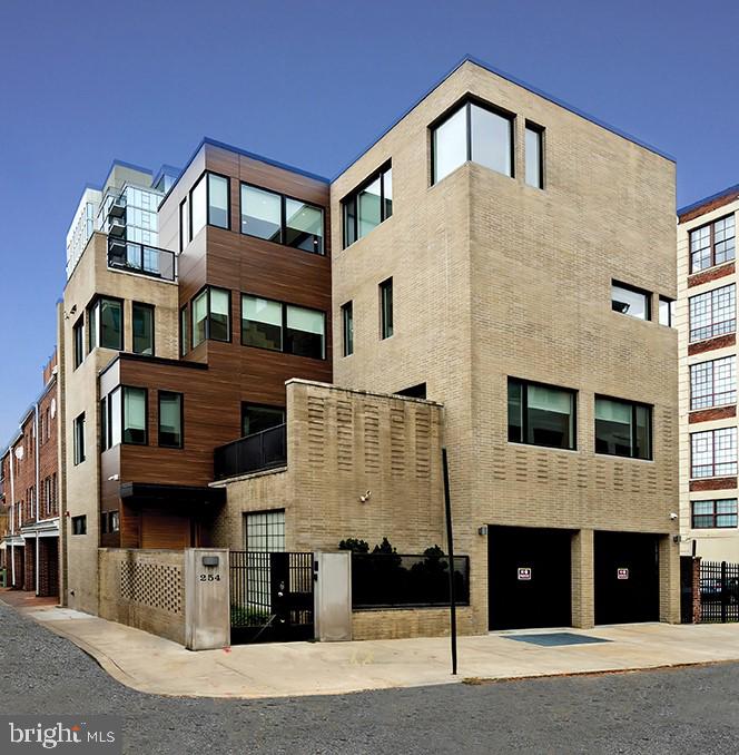 The one you have been waiting for! Modern, custom 6 bedroom, 5 full and 2 half bathroom home in the Fitler Square neighborhood of Philadelphia. No detail was spared in the design and build of this one-of-a-kind home. Upon arrival through a secure gate, enter into a grand foyer with slate floors. There is a mudroom with two walls of built-ins, great for storage, that also provides access to the oversized 2 car garage. There is a bedroom suite on this floor with full bathroom and nice closet space, as well as a large laundry room with a half bathroom and coat closet with hidden cedar closet. The second floor features a spacious living room, formal dining room and chef’s kitchen, all with ceramic heated tile. The living room has amazing natural light from walls of windows, a gas fireplace, built-ins and NanaWall bi-fold doors that lead to a terrace, perfect for grilling and dining al fresco. The large eat-in chef's kitchen offers stainless steel appliances--Wolf oven, microwave, stove; Sub-Zero refrigerator; and Bosch quiet dishwasher--coffee station, built-in banquette with custom made table to match countertops and a full pantry. The dining room has a built-in wet bar and room for an 8+ person table. Another half bathroom is on this level. The third level has 4 bedrooms each with custom fit out closets. The hall has a built-in window seat. Bedroom 1 is currently being used as a playroom and has a fun light fixture, built-ins, and an additional full stackable washer/dryer for convenience. Bedroom 2 has a built-in desk and bookshelf, a walk-in closet, and access to a Jack and Jill full bathroom. Bedroom 3 is also connected to this bathroom and has a built-in desk and walk-in closet. Bedroom 4 has an ensuite full bathroom, window seat and walk-in closet. The fourth level is home to the primary suite with a separate sitting area, gardened terrace, 2 walk in closets and a marble bathroom with heated floors, double sinks, oversized shower, vast vanity and more. There is also an office with built-ins on this floor. The completely finished basement has a full sized gym equipped with a rock wall, climbing rope and gym equipment. Adjacent to the gym is a media room with drop down projector screen, bar, blackout shades, bonus room and more. There is a full bathroom and more storage space on this floor as well. Additional features include exterior and interior security cameras, smart home with Control4 panels, surround sound, generator, 5-stop elevator, individual HVAC zones on each floor, and the third and fourth floors have their own water heaters. Located in the coveted Greenfield catchment with easy access to all that the Fitler and Rittenhouse Square neighborhoods have to offer, as well as direct access to Penn, CHOP and the Schuylkill River Park. Amtrak's 30th Street Station is a few minutes walk and the region's major thoroughfares and Philadelphia International Airport are nearby.