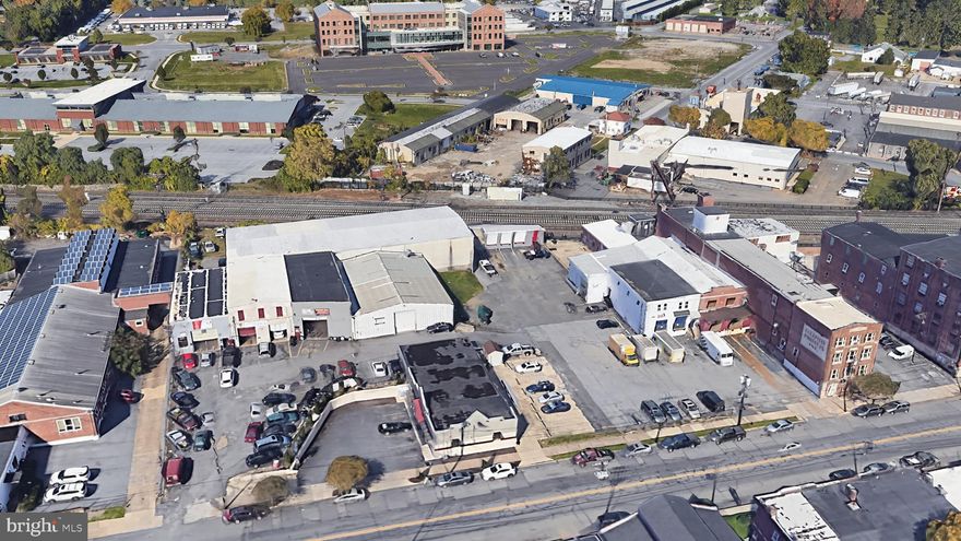 This site consists of a mixed use property with a 3 story building which is currently a mix of office and industrial
uses on the east end of the parcel, and a collection of industrial buildings on the west
end of the parcel. Most Industrial uses have drive ins, and a few have dock doors. 
Current income from existing use is $300,000 NOI approximately, which provides great income during plans for redevelopment. Most leases are on 1-2 year terms, allowing flexibility for redevelopment. 

Great opportunity for a redevelopment into self storage or apartments, with land consisting of 2.3 acres in Lancaster City with improved buildings. The zoning was successfully changed to Mixed Use recently which will allow for a potential density of 148 apartment units.

Architectural renderings show a 104 unit apartment building on the west end which
would call for the removal of industrial buildings. There are also plans for the renovation
of existing buildings on the east end to accommodate an additional 44 units. The
existing parking plan provides 126 parking spaces on site. A parking variance would be
required to provide relief from the parking requirement of 1 space per unit.

Self Storage is also a permitted use limited to 20,000 SF per parcel. 

Owner will consider seller financing for qualified buyers with a 30% down payment.  Contact listing agent for pro forma operating income and expenses.