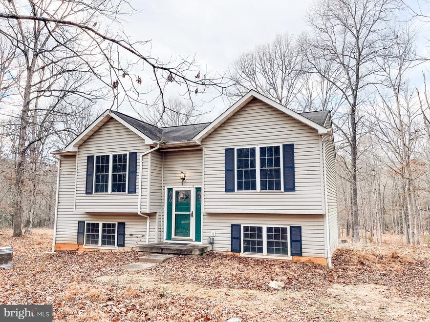 This 4 bedroom, 2.5 bathroom home  is situated on 3.47 acres with 350 feet of water frontage on Black Walnut Run Creek.  This property is truly park-like with room to grow.  The current owner started updating the home, but did not complete  due to relocating.   Updates include removal of carpeting and installation of wood laminate flooring.  Two bedrooms and one bath on the upper level and 2 bedrooms, 1.5 bathrooms on the lower level with a small den with french door to rear yard.   The main living room is open to the dining area and kitchen.  High  efficiency heat pump and smart hot water heater, large shed and stackable washer and dryer.  This home property is being sold as is and is ready for you to make it your own.