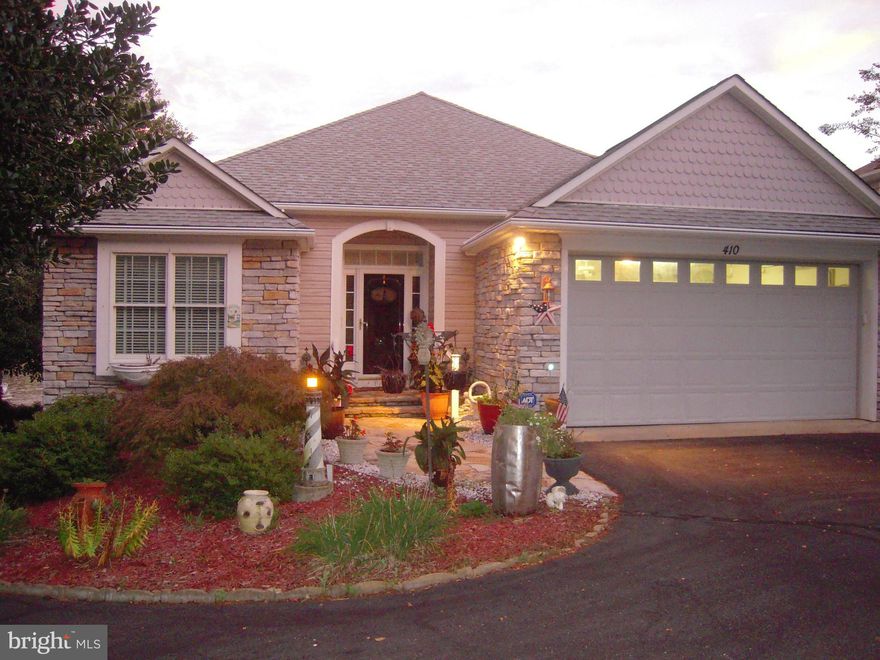 Great, one owner, waterfront home full of upgrades.  Don't judge the size of this home from it's looks! The square footage of the waterfront home is misleading from the front view.  Home boasts 3,700 plus square feet with oversized garage with 2nd Workbench and built-in cabinets. .  Walk in to a large ceramic foyer to greet family and friends.  Spacious Family Room  boasting  high cathedral ceiling, attractive marble-faced fireplace with heat-blower feature, hardwood flooring and sharing open plan to kitchen and breakfast area with bay window looking out to the Lake view. Gourmet Kitchen with ceramic flooring has eating bar,  an abundance of  high cabinets and drawers,  extensive Corian countertops, Stainless Steel appliances, Five burner cook-top, double sinks, pantry closet and more.  Entrance to Sunroom through attractive high Andersen French  doors - opening to Four-Season Sunroom (with separate AC/Heat Unit) with three full walls of beautiful large windows for full panoramic view of the Lake.  Primary Bedroom has built-in  full wall-unit and French doors leading to Sunroom.  Primary Bathroom with make-up vanity area and double vanity sinks, recently remodeled with larger ceramc shower and two walk-in closets -- one oversized.  Main level also has second bedroom with two closets (one was intented for future elevator) and full second bathroom.  Laundry/Mud Room has large pantry closet, utility sink and  recently replaced Washer and Dryer.  Continuing to the lower level with ceramic flooring  which could be used as an In-law Suite with large Family Room and 2nd Fireplace with Lake view, Dining Area, Second Kitchen and two additional bedrooms and Full Third Bathroom. Unfinished area of Lower Level has large workshop bench, built-in cabinets and lots and lots of storage area. Family Room opens to tiled covered patio to full view of Lake.  Backyard shed, fully landscaped yard (front and back), vegetable garden area, lake waterpump for yard and garden water supply, and full house generator,  Oversized dock - room for 3 boats. Great waterview and great swimming water.  Home Warranty is being offered with purchase. The home is warm, relaxing, comfortable, easy upkeep and is ready for your pleasure and enjoyment.  Come see all these features and more!