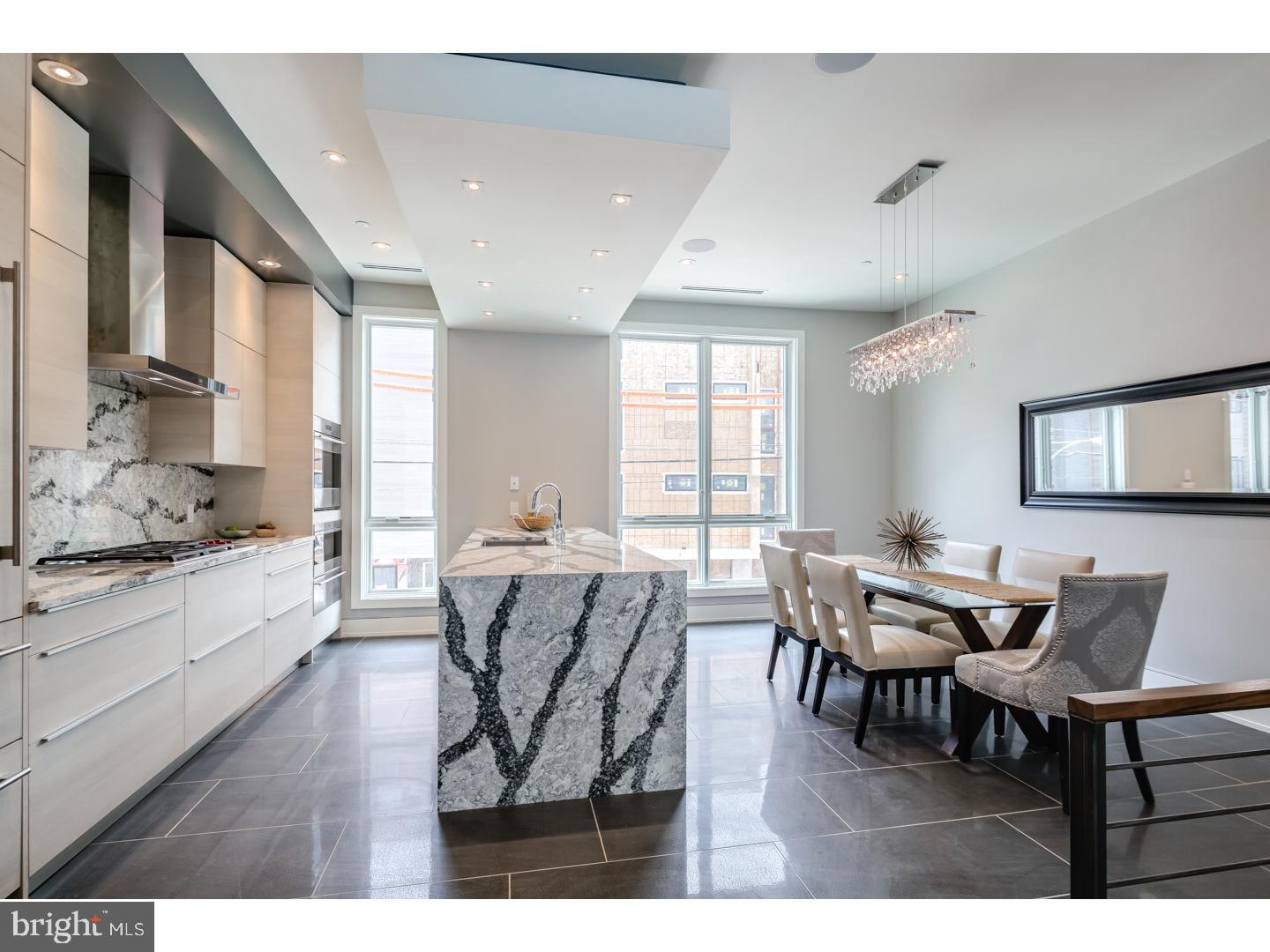 Three homes already sold!! get in before any price increases! One of a kind New Construction with Elevator, 2-car garage, 4 Decks including two Roof-decks, Smart-home tech system, 4500sq' of Luxury and most finely appointed details in the city. Liberty Estates Townhomes has it all. Included in this sophisticated home is a theater room, and a game room with large wet bar that's perfect for entertaining. The living room, dining area and living room has heated floors. The wide open and extra wide living area has a built in fireplace with stone ledge, and this magnificent space spills onto a rear tiled deck that will make you feel like you are in Miami. The kitchen is spectacular, with Sub Zero and Wolf appliances, custom Italian cabinetry, custom counter tops including a HUGE island with cascading waterfall stone edge and a custom floating ceiling with accent lighting. The extra wide, 20' wide floor plan allows for a huge dining area right next to the kitchen. The interior iron railing system continues throughout the home along an elegant Black Walnut wood staircase. The roof decks are equipped with a kitchenette with sink, fridge and built in grill. The private deck off the master suite, and the deck off the living room supply a ton of outdoor square footage, totaling over 900 Sq feet. All of the bedrooms have great space and have ample walk in closets and accompanying bathrooms with the finest Grohe and Kohler finishes. The full floor master suite has it all, a six foot Kohler soaking tub, heated floors, double vanity, glass tile shower, deck and huge closets. Each bathroom is unique and has only the best materials. The woodwork throughout the home is stunning- including the custom baseboards and solid wood doors t/o. This may be the most well thought out home in the city. Not one inch of space has been wasted. Come visit our 100% complete and ready to be lived in Model home. Still time to customize the other homes in the development. 10 year tax abatement pending!! 100% complete and ready for move in !! The finished basement and all heated floors are an UPGRADE and not included in the price.