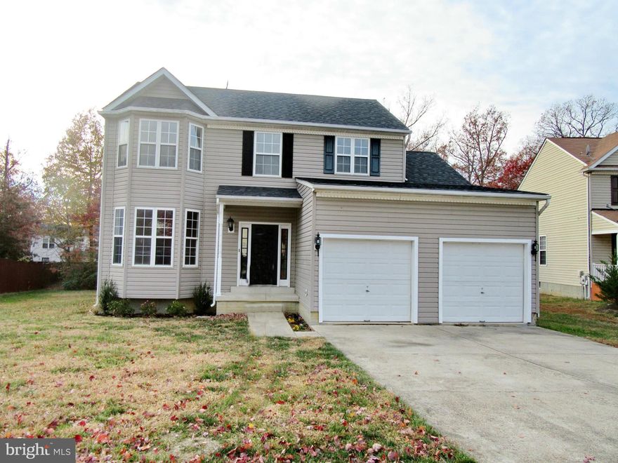 Home Sweet Home! Country kitchen with large center island/breakfast bar, gas range & eat in area. Separate dining room with bump out. Family room off kitchen with fireplace. Lg master suite w/lux bath w/soak tub, WIC & dble sinks. Finished basement w/4 BR (no closet) & full bath. Gleaming harddwood floors throughout main level, 2 car garage, deck overlooking level backyard.