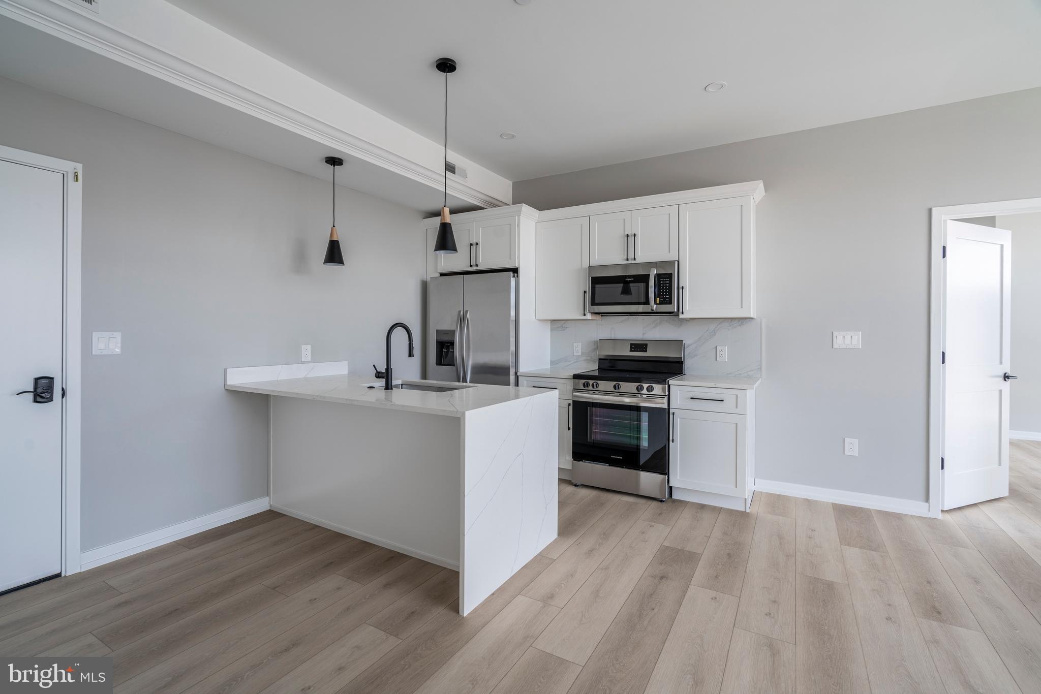 CURRENTLY OFFERING TWO MONTH'S RENT FREE FOR LEASES BEGINNING IN JANUARY 2025 AND EXTENDING TO SPRING/SUMMER 2026

Welcome to Innovator Village, nestled in the heart of Graduate Hospital! This gated community is home to 82 brand new construction, luxury units featuring top of the line finishes. 2401 Washington Ave offers everything you could desire in a city apartment and can be moved into immediately. This unit features a spacious, open living room with huge south-facing windows and lovely natural light, a kitchen with quartz countertops and stainless steel appliances, two beautiful bathrooms, hardwood floors and an in unit washer/dryer. The building also features an amenity room, elevator, beautiful brick exterior, and shared roof deck with fantastic views of Center City. Innovator Village is located on the bustling Washington Ave corridor with easy access to Drexel University, CHOP, Penn University, I76, restaurants, shops, public transportation and much more!