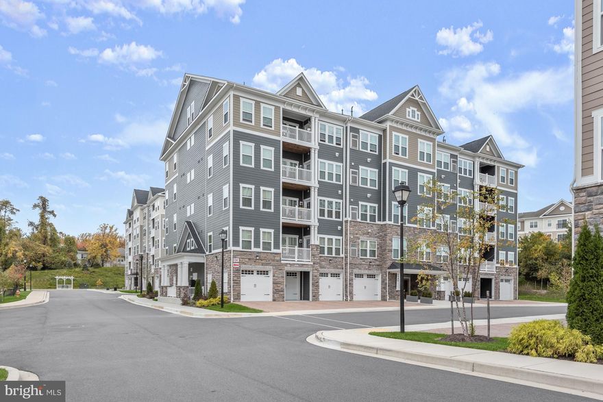 Welcome to 8940 Carls Court, a gorgeous condominium situated in the active adult community of Ellicotts Retreat. This stunning 2-bedroom, 2-bathroom unit offers an exceptional layout designed for comfortable living and entertaining. Step inside to find upgraded decorative ceiling fans with lighting, custom shelving in the storage closet, and a spacious kitchen complete with gas cooking, stainless steel appliances, stylish backsplash, quartz counters, ample cabinetry, and a breakfast bar. A lovely living and dining area enhanced with an abundance of natural light leads the way to the inviting balcony, ideal for enjoying the evening breeze. The sizable primary suite features a ceiling fan, plush carpeting, a walk-in closet, and an additional closet. The primary bath includes a double vanity, grab rails, and an oversized walk-in shower. One additional sizable bedroom with a dual-entry bath completes the inside of this light-filled unit. An attached garage with an electronic opener, an electric car charging port, and an extra-long driveway set this unit apart from the others in the community. Enjoy the convenience of a tankless hot water heater and programmable keyless front door entry to the unit through a keypad. As a resident of this vibrant community, you will have access to a wonderful community clubhouse. Located near major commuter routes, shopping, and dining, 8940 Carls Court provides an ideal location for active adults seeking comfort, convenience, and a low-maintenance lifestyle. Schedule your showing today and experience all that this exceptional property has to offer.