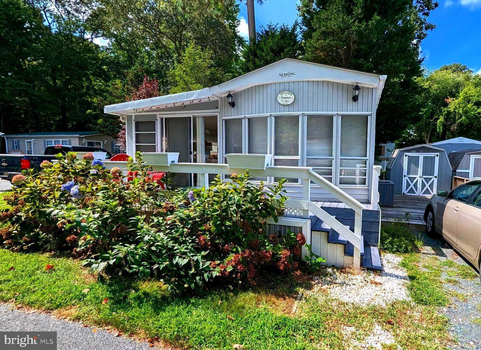 Discover the charm of coastal living in this well maintained 2-bedroom, 1-bath manufactured home with a spacious addition, nestled on a desirable corner lot in the tranquil White Horse Park community, located in Ocean Pines, MD. This seasonal retreat offers a perfect escape with its serene surroundings, ideal for those looking to unwind near the coast. The home features a generous living area, a well-appointed kitchen, and cozy bedrooms, making it a comfortable getaway. White Horse Park provides an array of amenities, including a community pool, playground, boat ramp, and clubhouse. Enjoy the best of both worlds—peaceful park living with easy access to the vibrant Ocean City beaches and boardwalk. Don't miss out on this unique opportunity to own a piece of paradise in a sought-after seasonal community! Fully updated in the past 3 years on the interior and the roof is approximately 4 years old. Fully furnished to include one Tempurpedic king size bed and one memory foam queen size bed. New HVAC system installed! Your vacation oasis awaits!