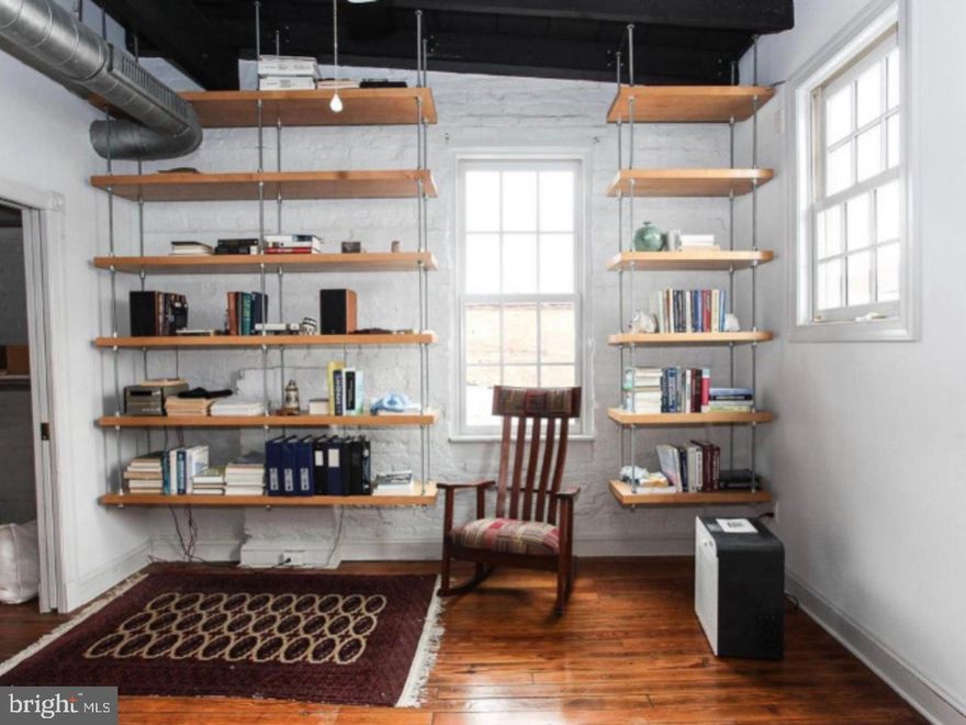 This 2 bed 2 bath industrial style apartment gives you all the charm and character wanted in downtown Frederick city life. Two Primary bedrooms or roommate style apartment. Also includes access to a roof deck. Apartment features: ceiling fans, walk-in/walk-through closets to ensuites--one with a jetted tub and the other with a standalone shower and access to hallway, in unit washer and dryer, skylights, tall ceilings and open floor plan. The hardwood floors are repurposed siding from a piano shop. Plus the kitchen was just renovated! Come see it to believe it.  Rent includes water. Small Pets less than 25lbs may be accepted.  There is an extra security deposit of $500 per pet.  Available starting June 1st.  Application fee is $38 per persons over 18 years old.