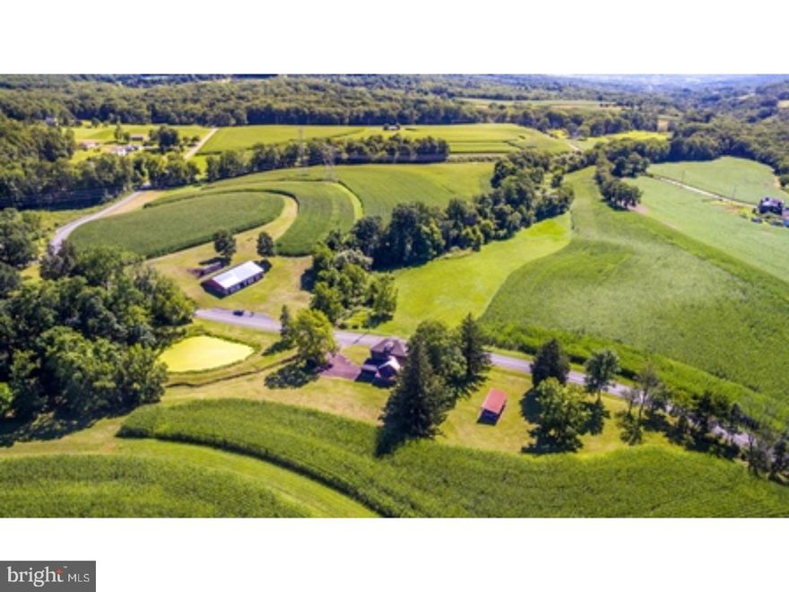 Three parcels totaling 133 Acres of beautiful farmlands and woods with 4 houses. The property was operated as a Pick Your Own fruit orchard from the early 1970's until 2006. There is a conservation easement in place that allows for the building of one more home in addition to the four homes that are currently on the property (each with their own septic system). Easement allows for agricultural uses including farming, livestock, horses, etc. Additional buildings can be built that support the agricultural use of the property. There are two small ponds, two small streams, a stone barn foundation with new roof (80' x 50') and building previously used as the fruit stand. Great opportunity for many uses with existing rental income.