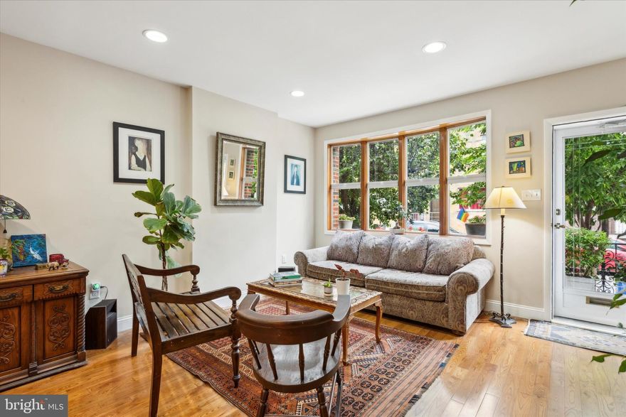 Welcome to 827 Moore St! Nestled on a charming, tree-lined street in East Passyunk Crossing, this home offers a serene escape close to city amenities. Enjoy abundant natural light from south-facing windows, elegant hardwood floors, an open floor plan, a beautifully detailed iron staircase, a convenient half bath off the kitchen, three spacious bedrooms, and more. Upon entering the home, you will immediately be struck by the vintage charm of the intricately carved wooden front door-so charming and unique. A bay window adorned with custom blinds graces the living area, seamlessly merging with the dining space. Adjacent is a convenient half bath. The kitchen boasts ample cabinet and counter space, both above and below. The layout accommodates a kitchen island or a cozy breakfast nook by the sliding glass doors that open to the sunny backyard! Start your day with a morning coffee bathed in sunlight or host delightful backyard BBQs in the expansive outdoor space. The basement is an ideal storage space - dry and pristine! Additionally, the laundry section is equipped with a sink and includes the washer/dryer unit. Ascending the stairs to the upper floor, you'll be captivated by the antique iron railing that gracefully spans the staircase and landing, showcasing exquisite old-world craftsmanship. The upper level showcases hardwood flooring throughout the bedrooms. The rear bedroom boasts a spacious closet, while the versatile middle bedroom can serve as an office, bedroom, or walk-in closet with its connecting door to the front bedroom. The well-appointed bathroom features a charming sink with storage, a toilet, refinished tiles, a bathtub, and a luxurious rain shower. The primary front bedroom offers generous space to accommodate any bed size, side tables, and a cozy sitting area. This meticulously maintained home is ready for you to move right in. Discover this charming home in Sunny South Philly - it could be yours!