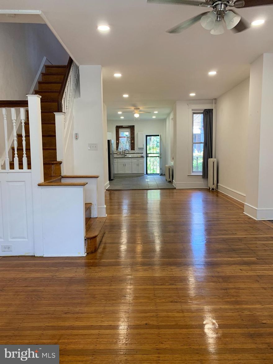 Welcome to 3848 N Gratz Street – a beautifully updated 3-bedroom, 1.5-bath townhome. This move-in-ready home features gleaming hardwood flooring and recessed lightening throughout. The kitchen is equipped with a stainless steel refrigerator, built-in microwave, gas stove, and ample cabinet space. The fenced-in backyard offers a private outdoor retreat. The home also includes a newly renovated full bathroom, along with a convenient half bathroom in the basement. The basement is equipped with a washer/dryer hookup for added functionality. All three bedrooms are generously sized and feature ceiling fans and closets. Located near public transportation, Temple University Hospital, schools, and local markets—everything you need is just minutes away. Don’t miss out on this Nicetown gem—schedule your showing today!