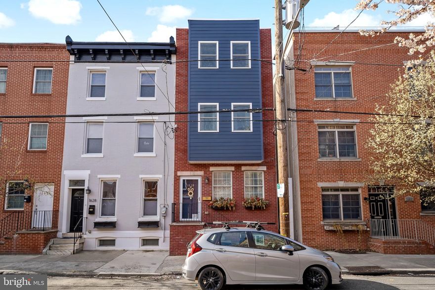 Exquisite 3 bedroom, 2.5 bath Graduate Hospital home now available for your most discerning buyers! This gorgeous light-filled town home is over 2,500 square feet with the finished basement, high ceilings & hardwood floors throughout. The open concept first floor features  living room with a natural stone gas fireplace, open switch-back staircase with traditional details & spindles. There is an expansive dining room and airy  kitchen making it ideal for entertaining. The spacious kitchen with peninsula has room for seating and features cherry cabinetry, stainless steel appliances, brushed nickel hardware & faucet. The outside Patio was fully redone with cedar plank fence, thermal flagstone pavers,  custom lighting and even a secret grill utensil holder. Ready for the warm weather dining & entertaining! The second floor boasts two spacious bedrooms with ample closet space, a large full bath & hall laundry closet with side by side washer/dryer. The bath features an over-sized vanity with extra storage, granite counters & tub.  The 3rd floor features and entire floor dedicated to the primary suite bedroom with primary bath & walk-in closet complete with brand new custom closets! The double doors lead to an abundance of warmth and light. As you proceed to the rear, you will find the large walk-in closet and the spacious bath with floor to ceiling subway tiles, hexagonal porcelain-marble floor tiles;  frameless glass enclosure with double shower heads/wands, marble seating, stylish Mediterranean floor tiles, integrated shower drain; Free standing tub with modern tub filler and matching faucet hardware on the his & her vanities and a private water closet. The basement is fully finished which adds for the perfect flex space. It has a wet bar, mini fridge and ice maker with a large window for natural light. There is also half bath on this level with  roughed in plumbing for a shower. The owners remediated all the stucco when they took ownership, also replaced roof, doors and windows. So you can move in with confidence.  All this in amazing graduate  neighborhood close to food, shopping, and more! Make your appointment today! Offer deadline Monday  April 4, 2022 at 9am. Sellers reserve right to accept offer prior should they choose.