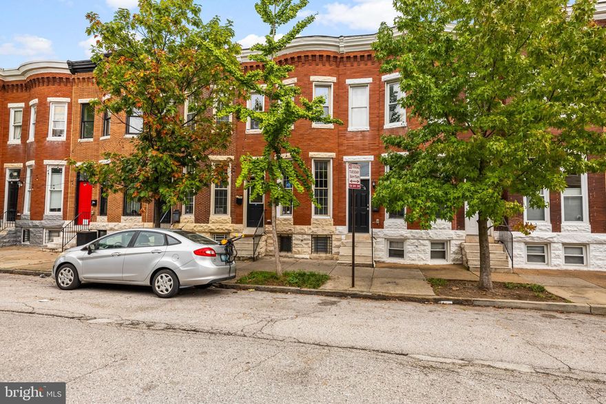 Come on in and enjoy hardwood flooring, copious amounts of natural light pouring through the bay windows, a gourmet kitchen with SS appliances and granite counter-tops, exposed brick throughout, 2 master suites upstairs both with their own bathroom, a spacious deck right off the kitchen, crown molding, trey ceilings and a large basement area that can easily be converted to a third bedroom with its OWN BATHROOM, wet-bar and built-in for entertainment center.  Laundry area is located in the back area of the basement. NOTE: The back patio has the potential to easily be converted into a parking pad so you'll never have to stress over parking again.  Don't miss your chance to tour this Patterson Park gem today!